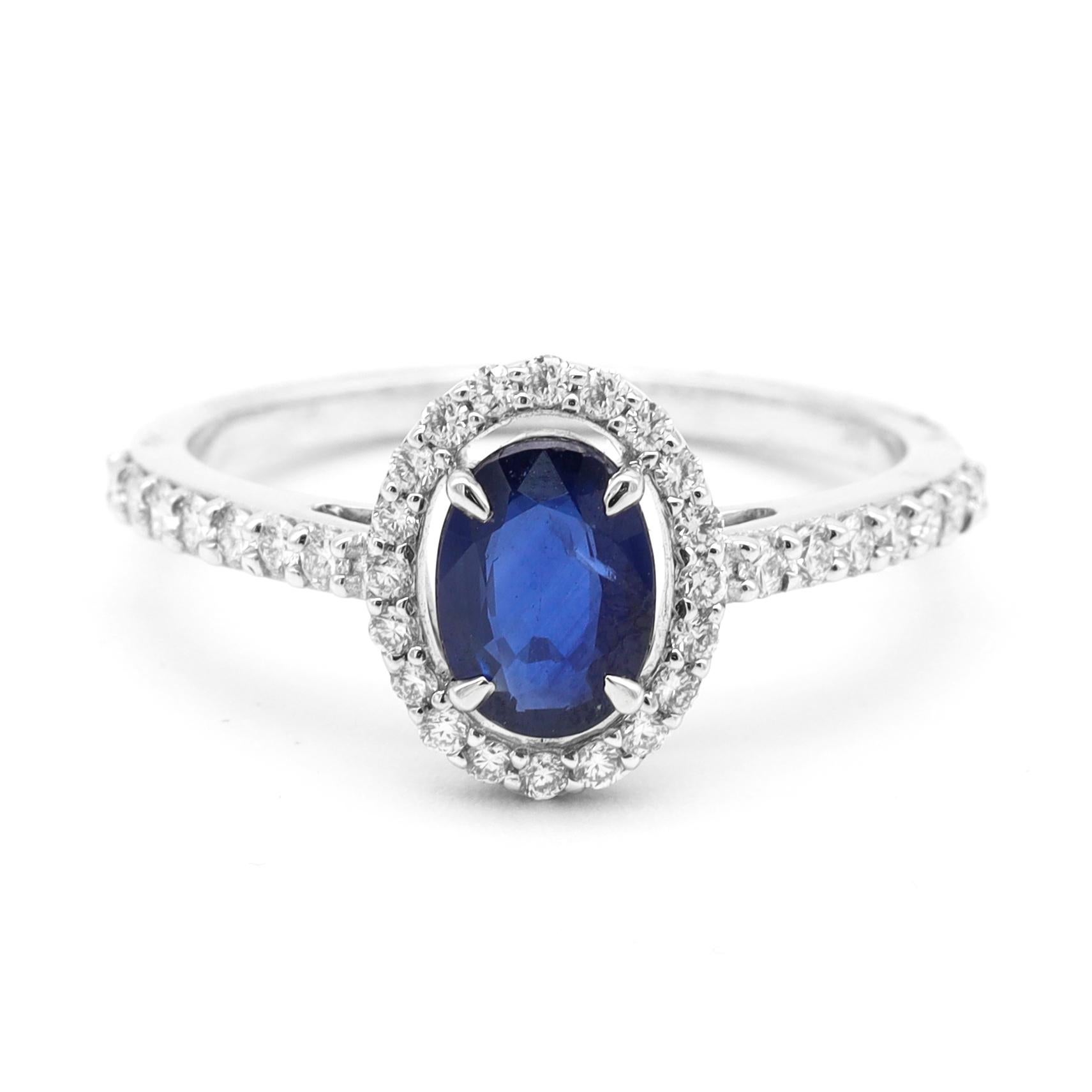 Women's 18 Karat White Gold 1.00 Carat Blue Sapphire and Diamond Halo Cluster Ring For Sale