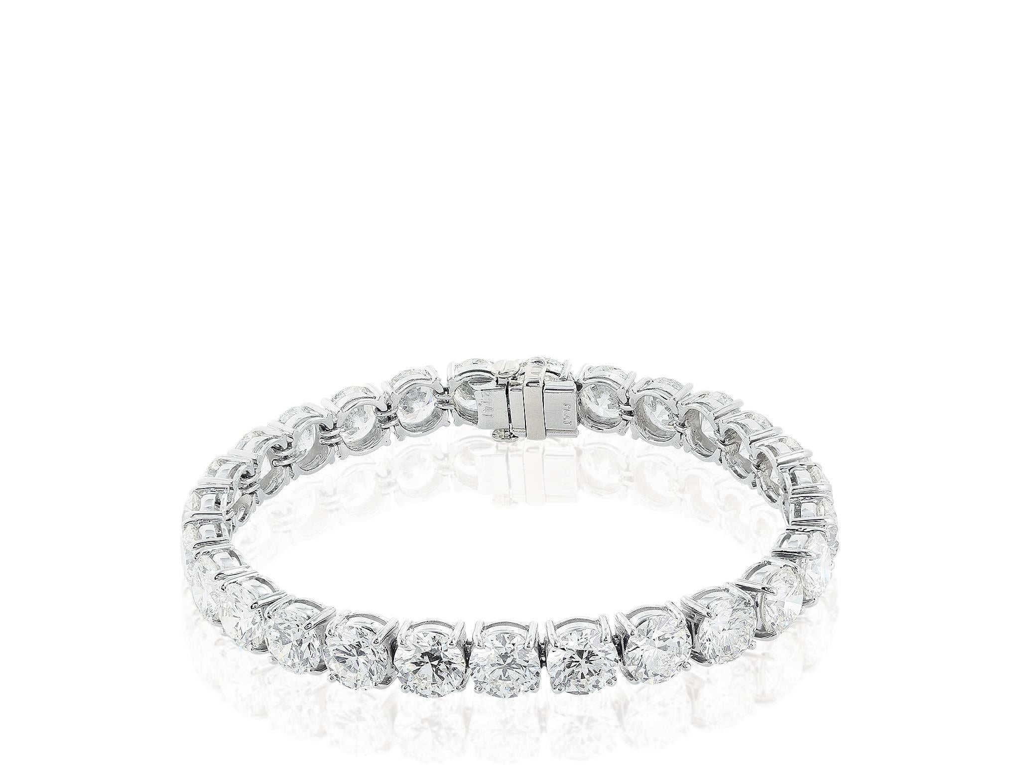 18 karat white gold diamond tennis bracelet, featuring 38 round brilliant cut diamonds have an approximate weight of 10.00 ct. tw. having a color and clarity of F VS. The diamonds are set in four prong basket heads.