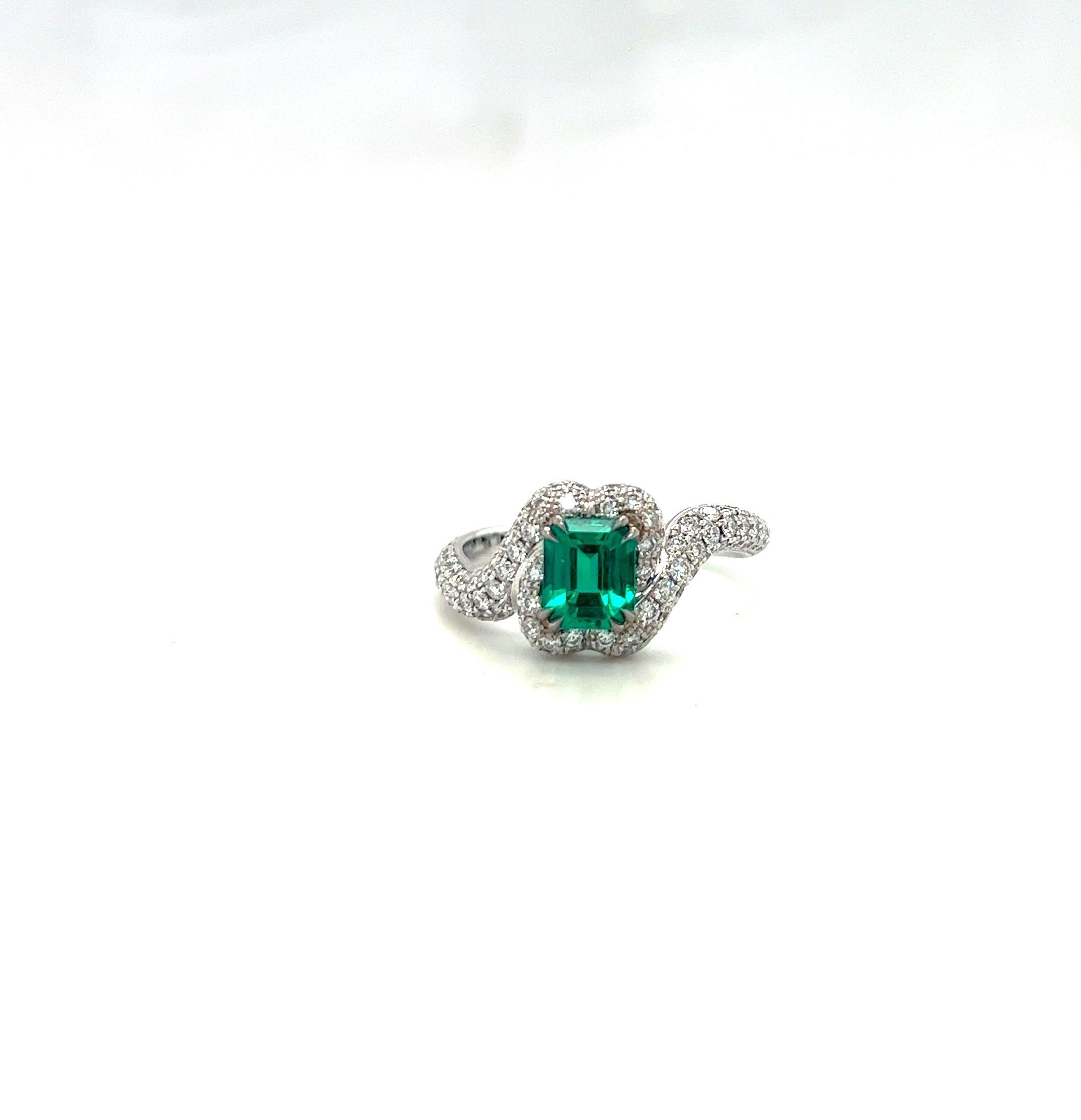 This 18 karat white gold ring centers a 1.00 carat emerald cut Colombian Emerald. The vibrant Emerald is beautifully set in a pave diamond organically shaped setting of 1.01 carats.
The ring size is 8.5, but can be sized.