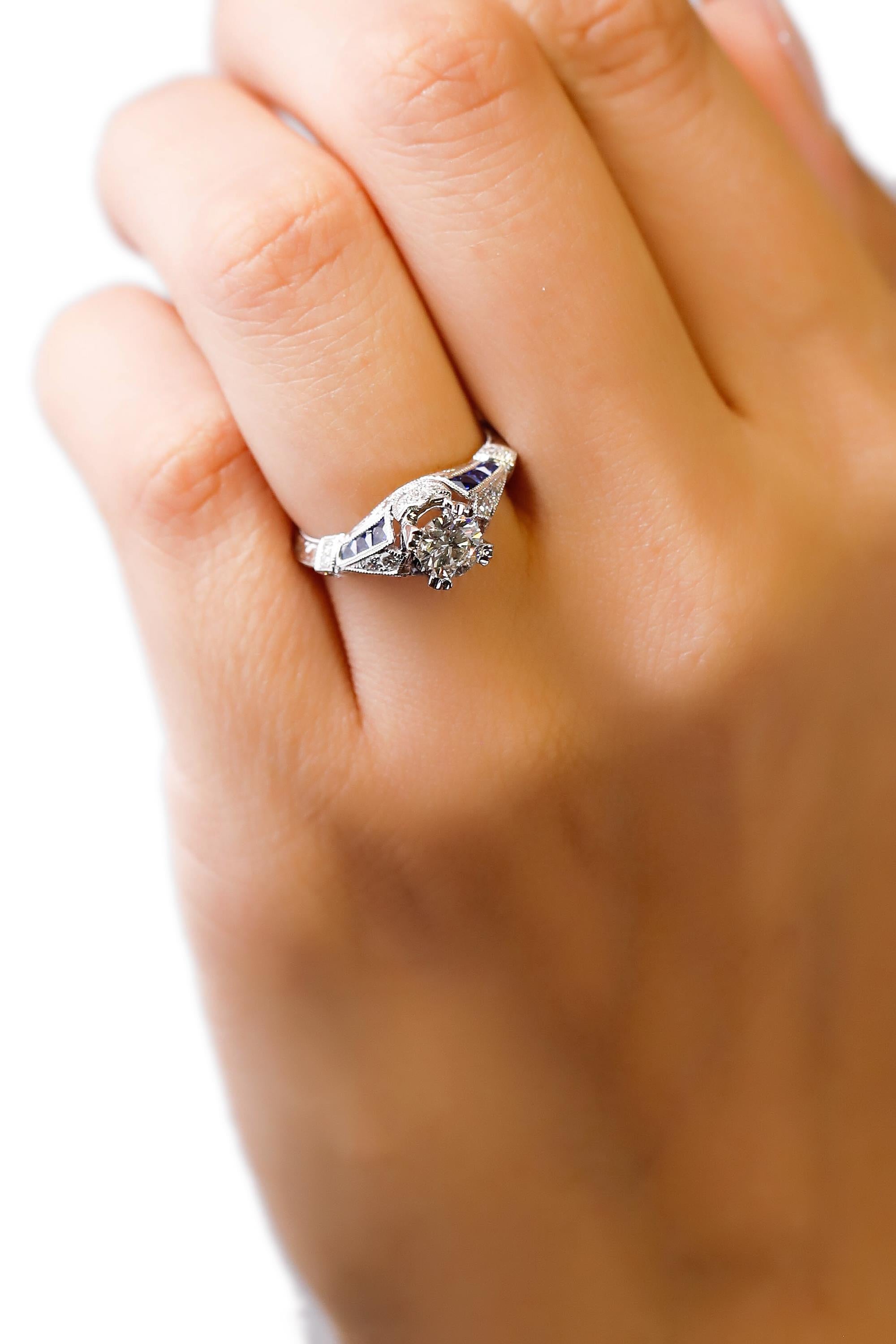 Modern 18 Karat White Gold 1.03 Carat Diamond 0.22 Carat Sapphire Engagement Ring For Sale