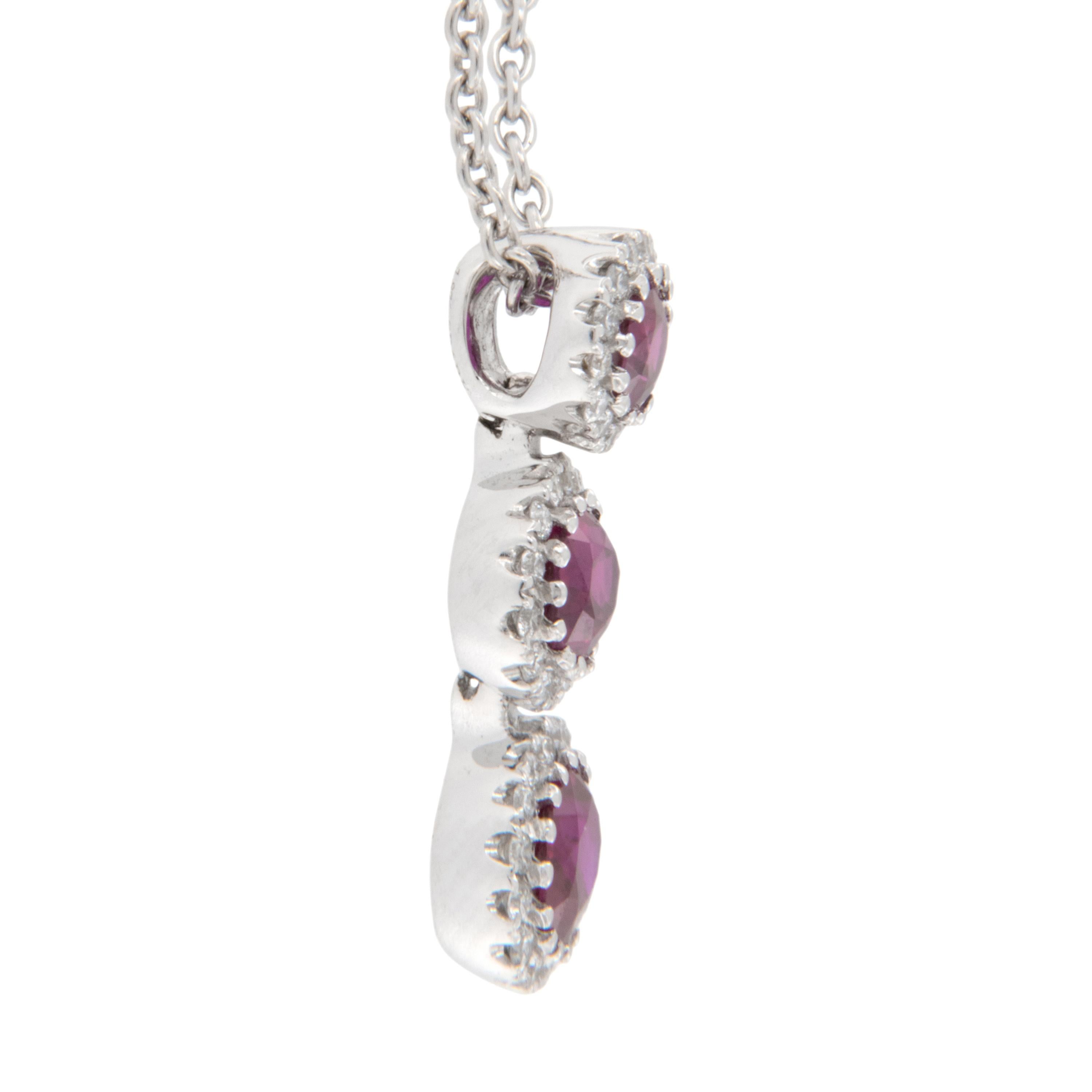 Spark Creations are well known for their yummy rubies, sapphires & emeralds! This 18 karat white gold 3 oval ruby drop necklace is a testament to exactly that! With 1.08 Cttw of fine red rubies &  .18 Cttw of fine diamonds this necklace will lay