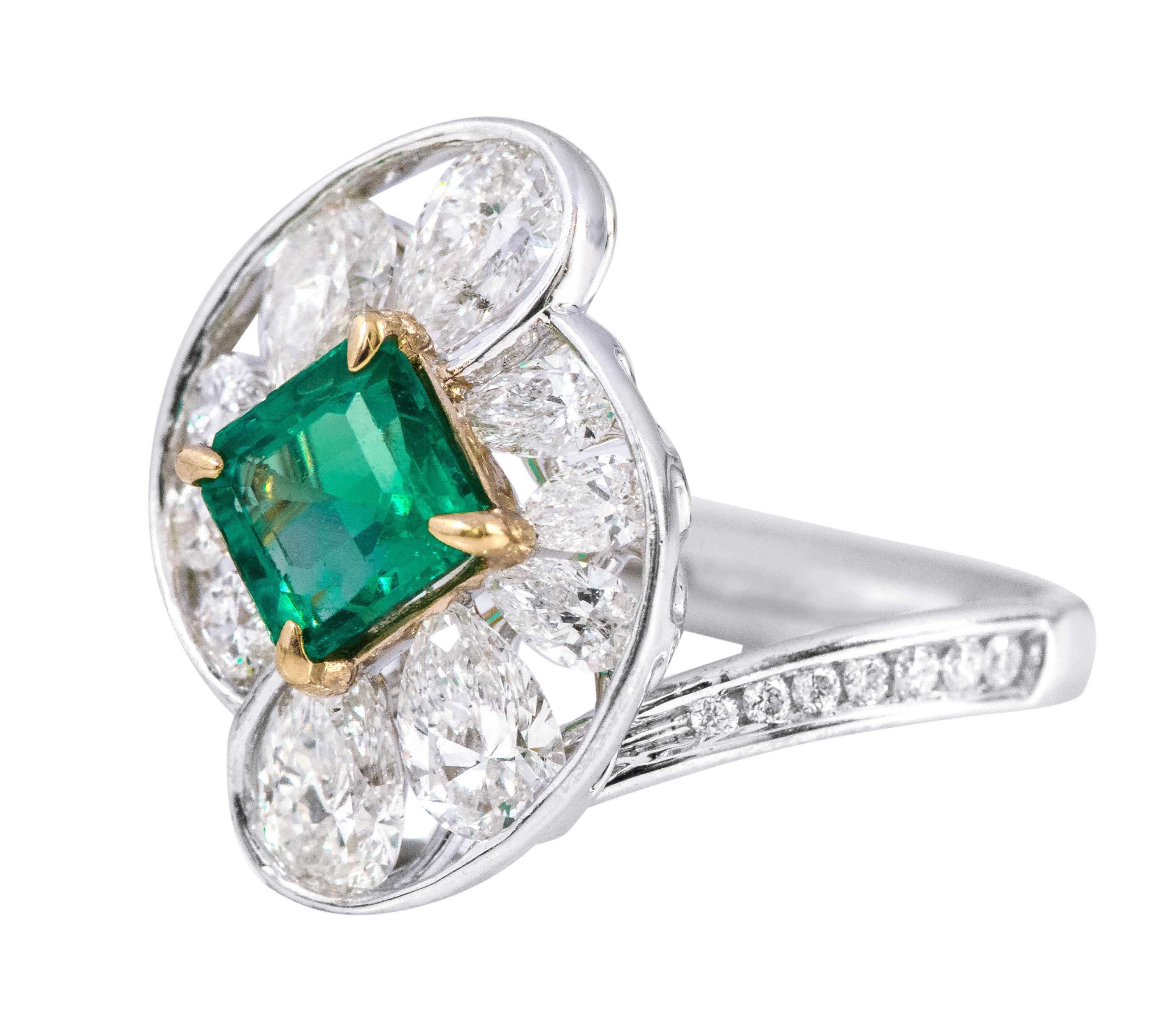 18 Karat White Gold 1.10 Carat Natural Emerald and Diamond Cluster Cocktail Ring

This exemplary parakeet lush green emerald and diamond ring is mesmerizing. The leveled-up solitaire perfect square emerald in the center in eagle prong setting is