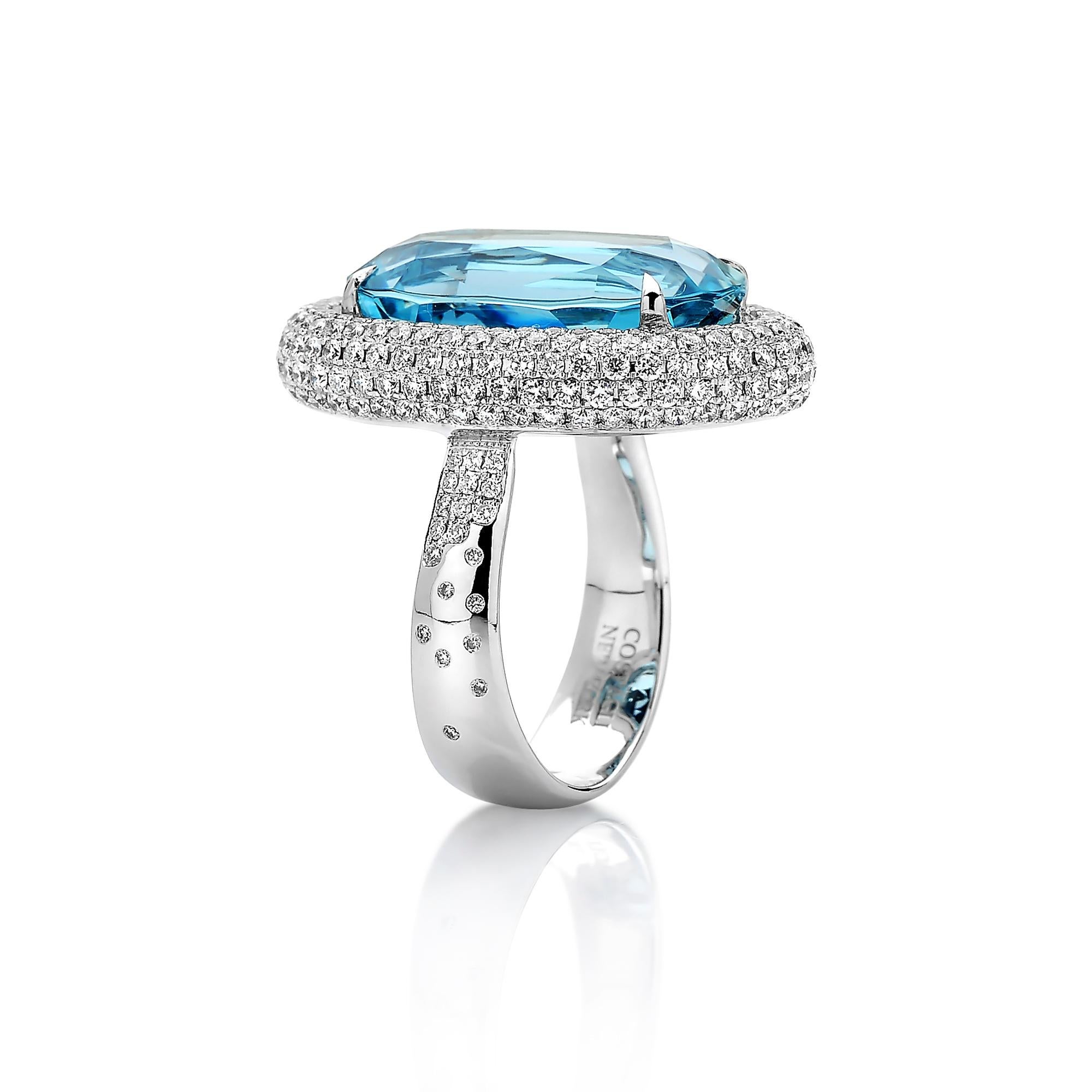 One of a kind 18 karat white gold oval-shape aquamarine ring with pave-set round, brilliant diamonds. 

The beauty is in the details - from the combination of hues, the cut of the gemstones, and the color of gold in the mountings, every element is