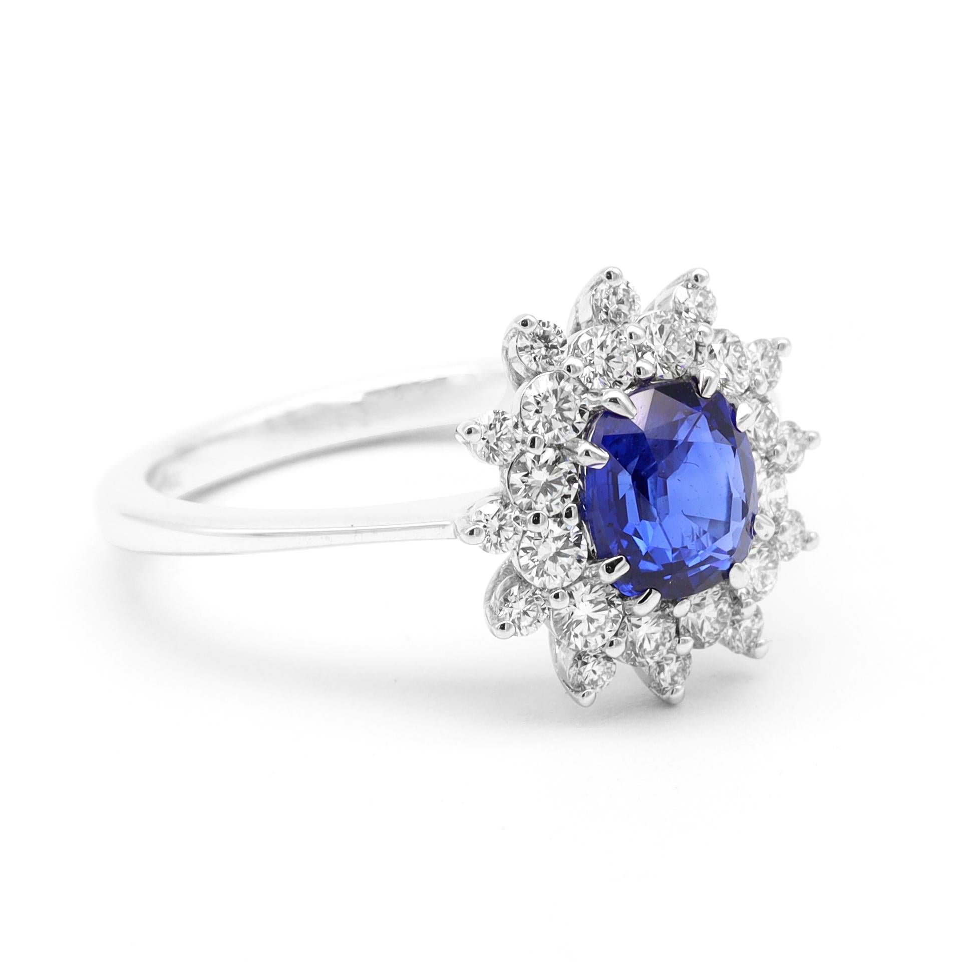 18 Karat White Gold 1.30 Carat Blue Sapphire Oval-Cut and Diamond Cluster Ring

This incredible Egyptian blue sapphire color and diamond ring is electrifying. The transparent oval cut 8-eagle prong set blue sapphire is rightly surrounded by the