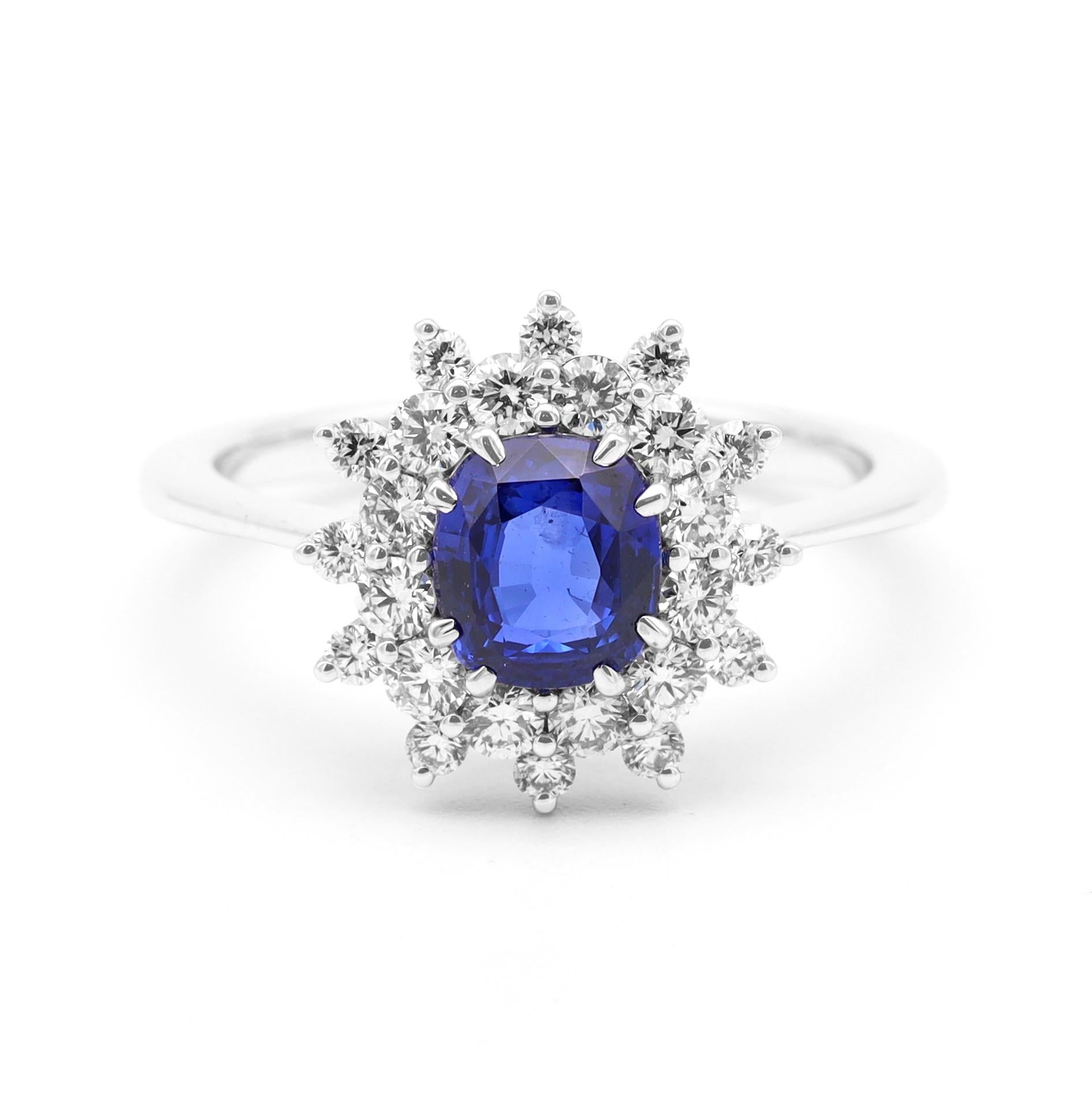 Women's 18 Karat White Gold 1.30 Carat Blue Sapphire Oval-Cut and Diamond Cluster Ring For Sale