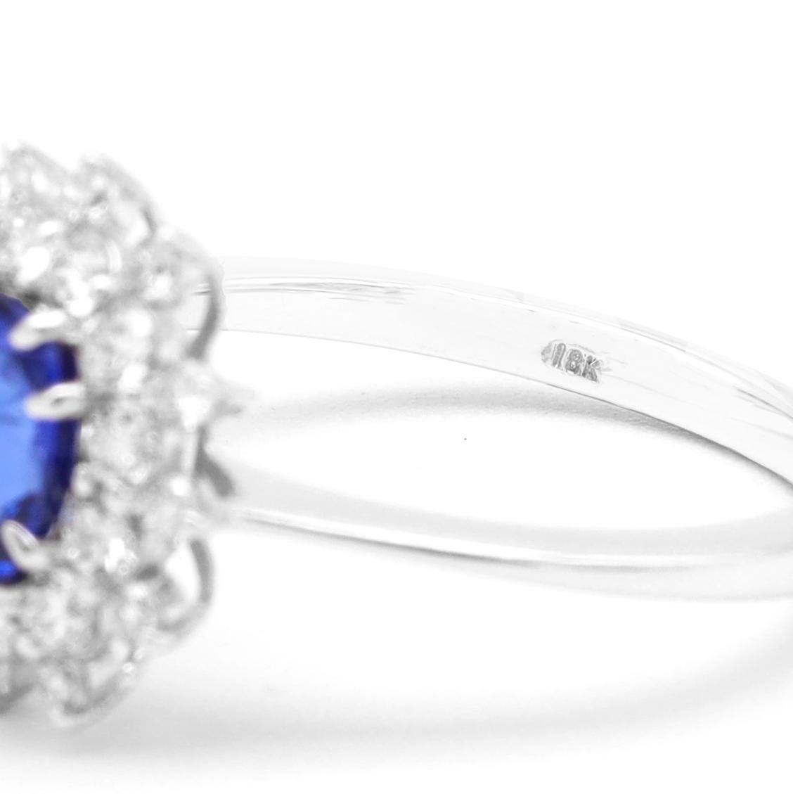 18 Karat White Gold 1.30 Carat Blue Sapphire Oval-Cut and Diamond Cluster Ring For Sale 1