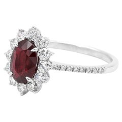 18 Karat White Gold 1.35 Carat Deep Red Ruby Oval-Cut and Diamond Cluster Ring