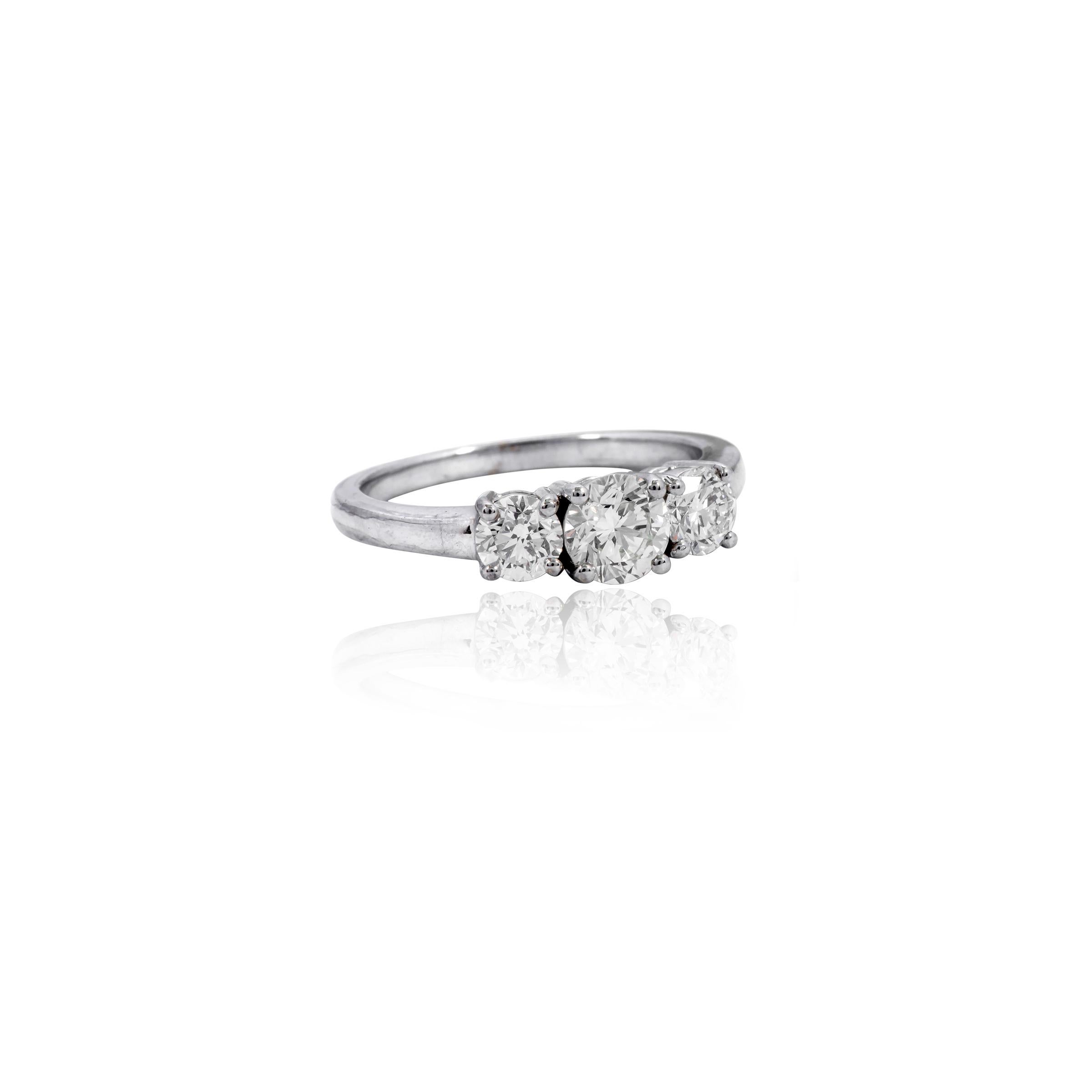 18 Karat White Gold 1.40 Carat Diamond Engagement Three-Stone Solitaire Ring

This graceful 3-stone classic diamond solitaire ring is profound. The three-stone trinity ring tells a story by not only representing the said “past, present, and future”