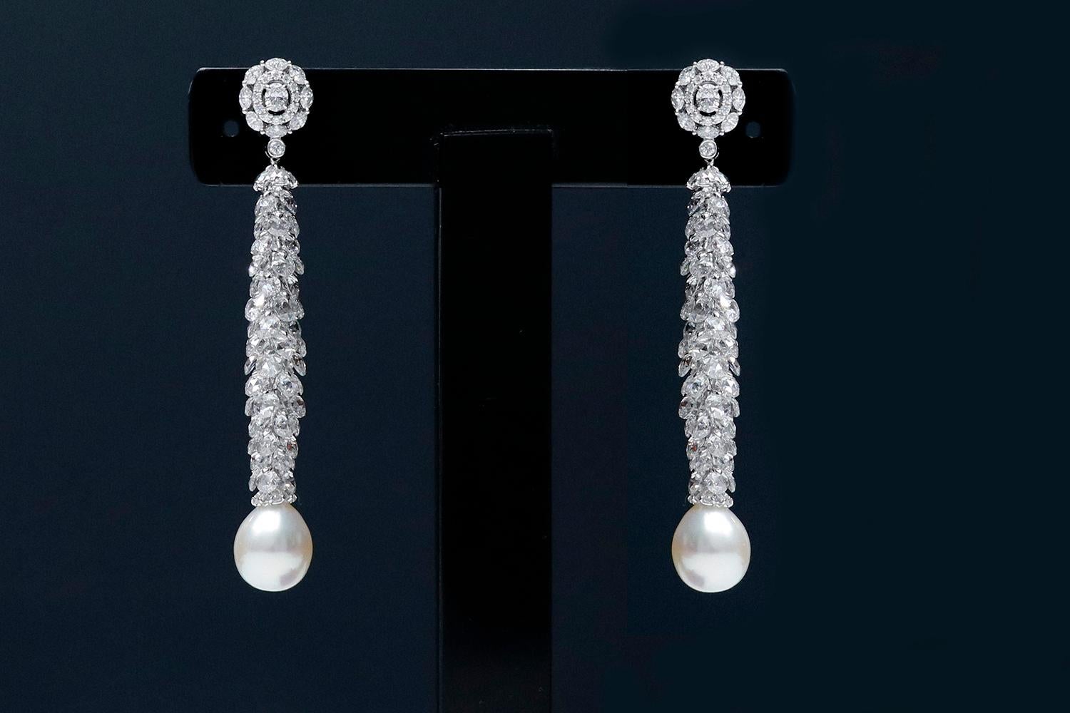 18 Karat White Gold 14.64 Carat Diamond and Pearl Cocktail Drop Earrings

This is a beyond imaginative pearl drop earring pair. The conceptualization of this design is inspired by the Christmas Fraser fir tree, which is turned upside down and