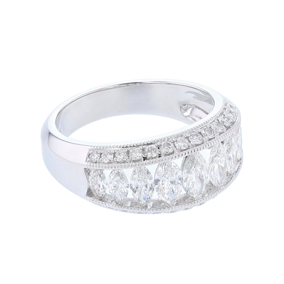 The ring is made in 18k white gold and features 9 Marquise cut, diamonds, channel set weighing 1.14cts and 28 round cut, prong set Diamonds weighing 0.35cts with a color grade (I) and clarity grade (SI1). 