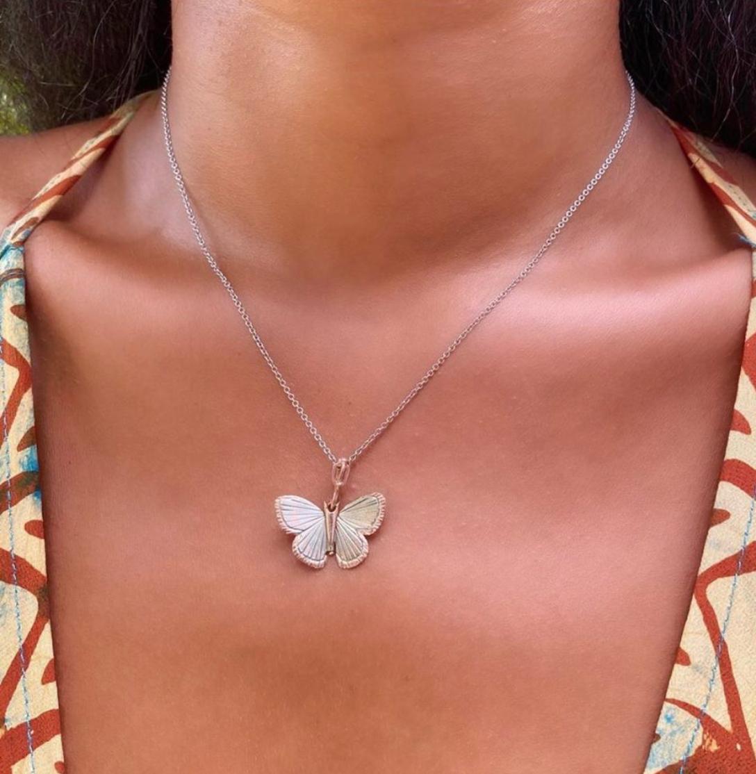 James Banks's signature butterfly necklace features a Palos Verde butterfly with a hinge at the center to allow movement of the wings, set in 18k White Gold with 14k Rose Gold inlay trim and hung on a 17