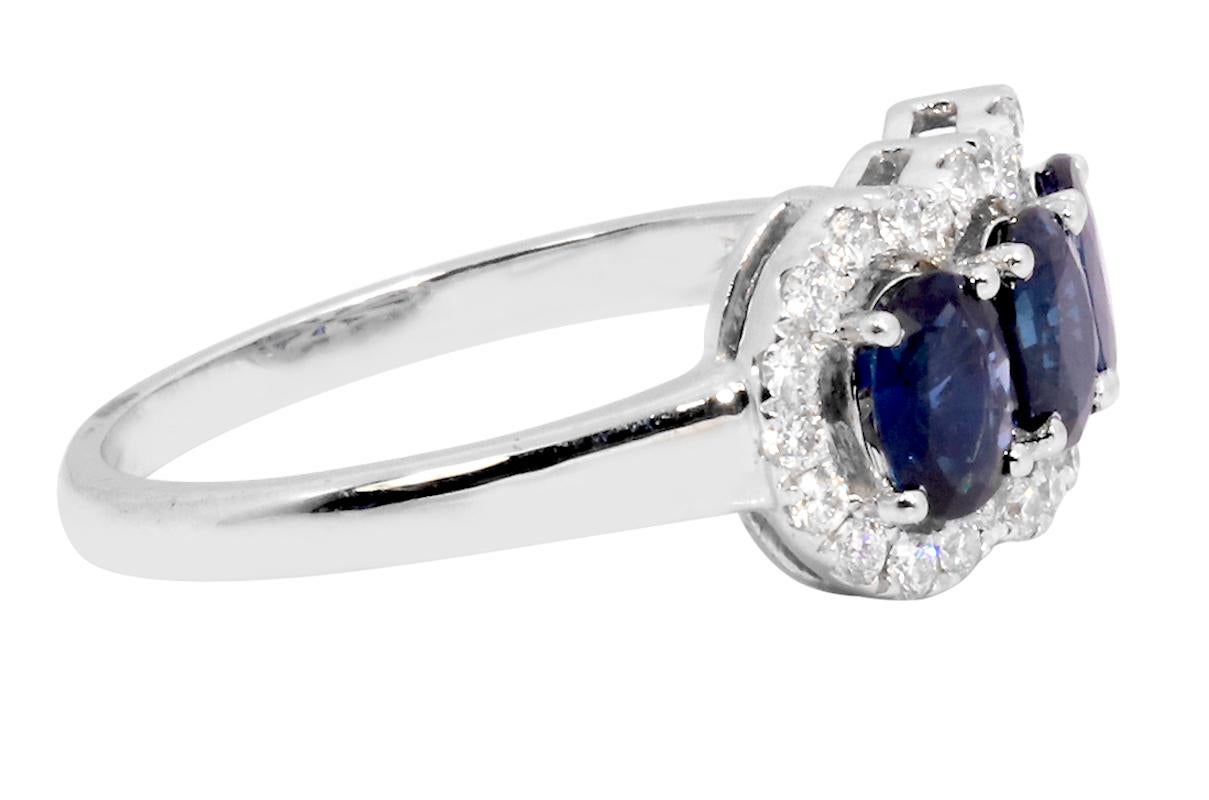 Oval Cut 18 Karat White Gold 1.52 Carats Sapphire and Diamond Three-Stone Ring For Sale