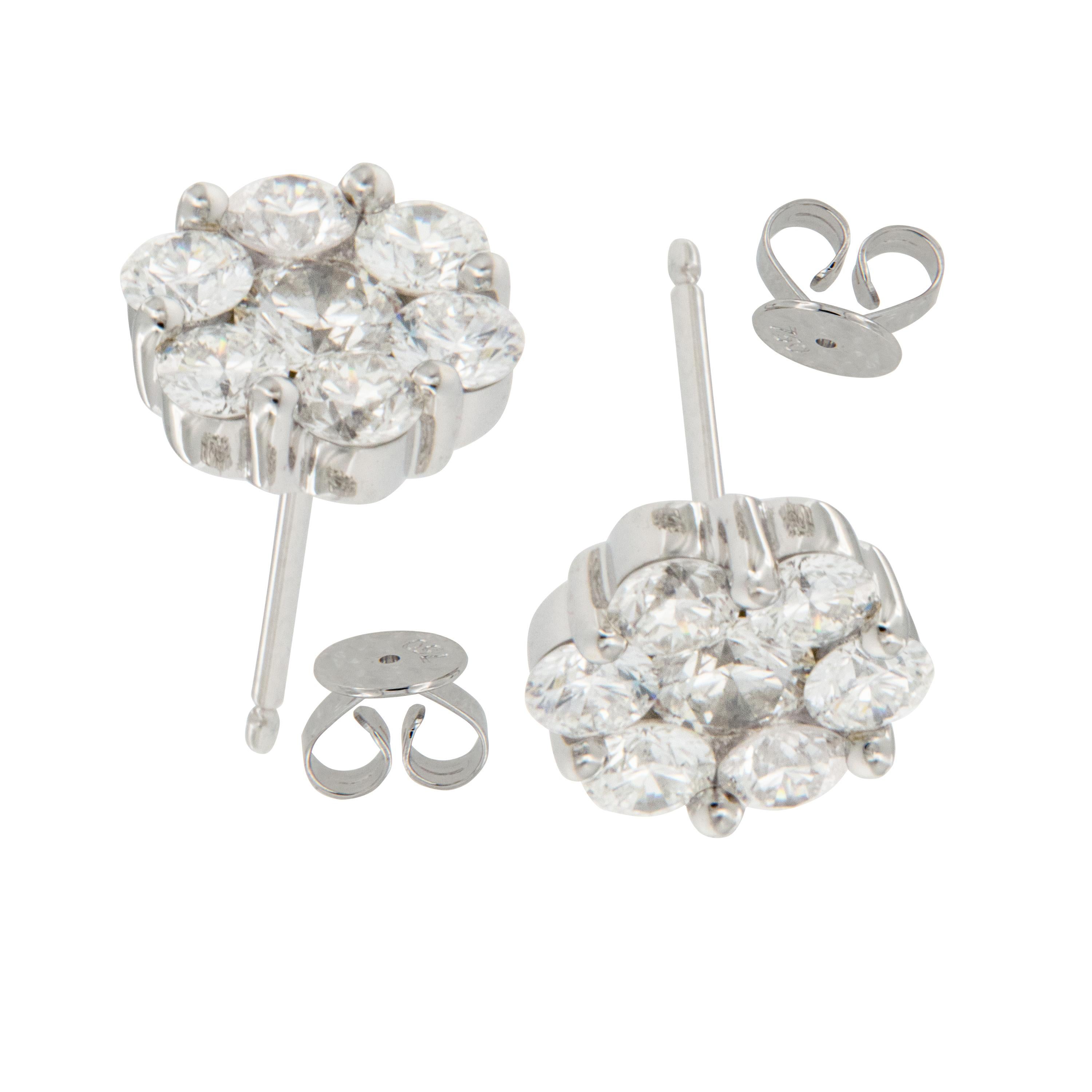 You can't go wrong with these fabulous cluster stud earrings! Made from fine 18 karat white gold & set with 1.55 Cttw of VS clarity & F-G color diamonds having posts & friction backs. These earrings have a substantial presence on your ears!