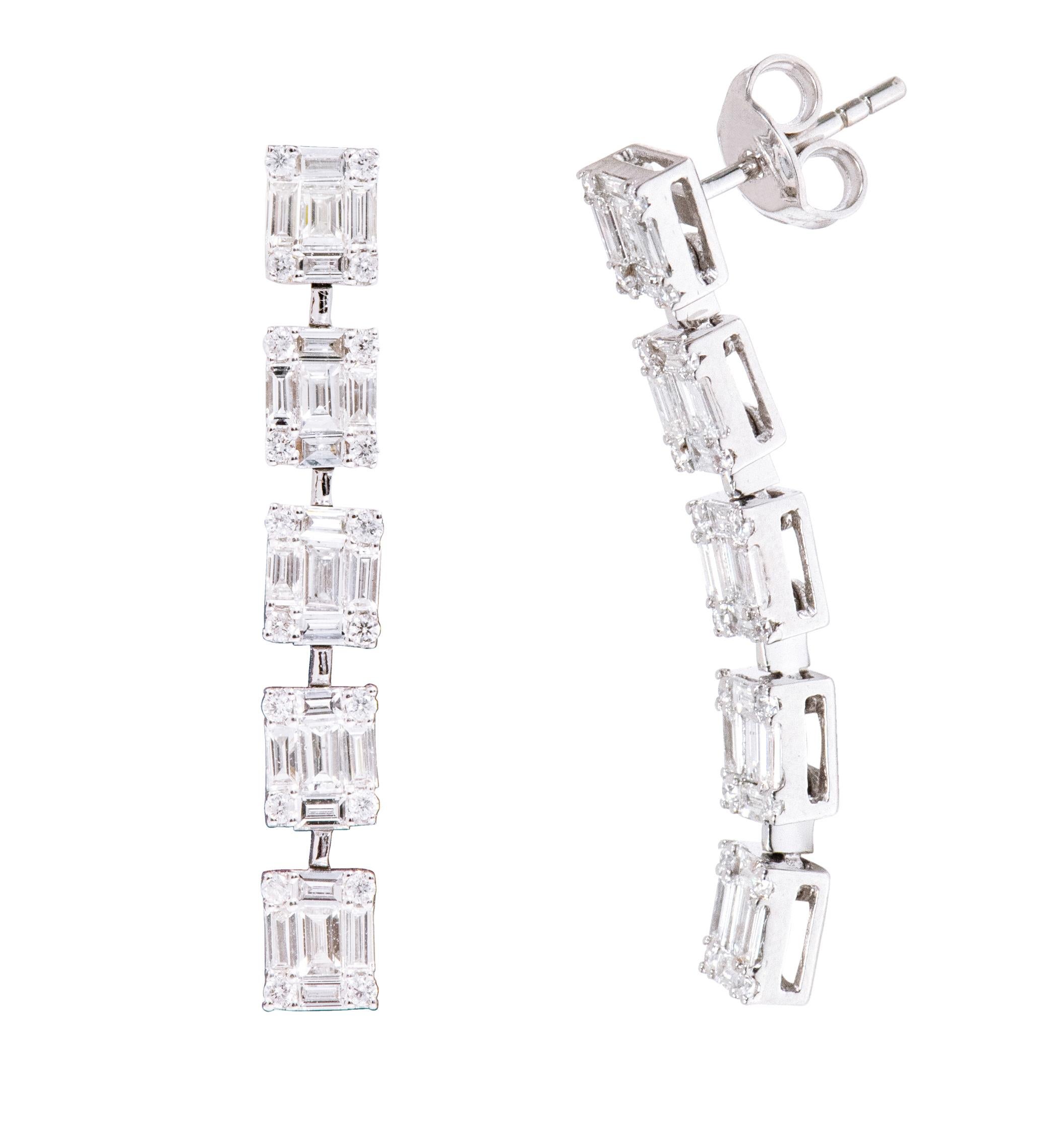 18 Karat White Gold 1.59 Carat Diamond Dangle Earrings

This incredible invisible set emerald cut diamond long hanging earring is timeless. The invisible diamond emerald cut is a crafty design wherein 3 smaller baguette-cut diamonds in the center, 2