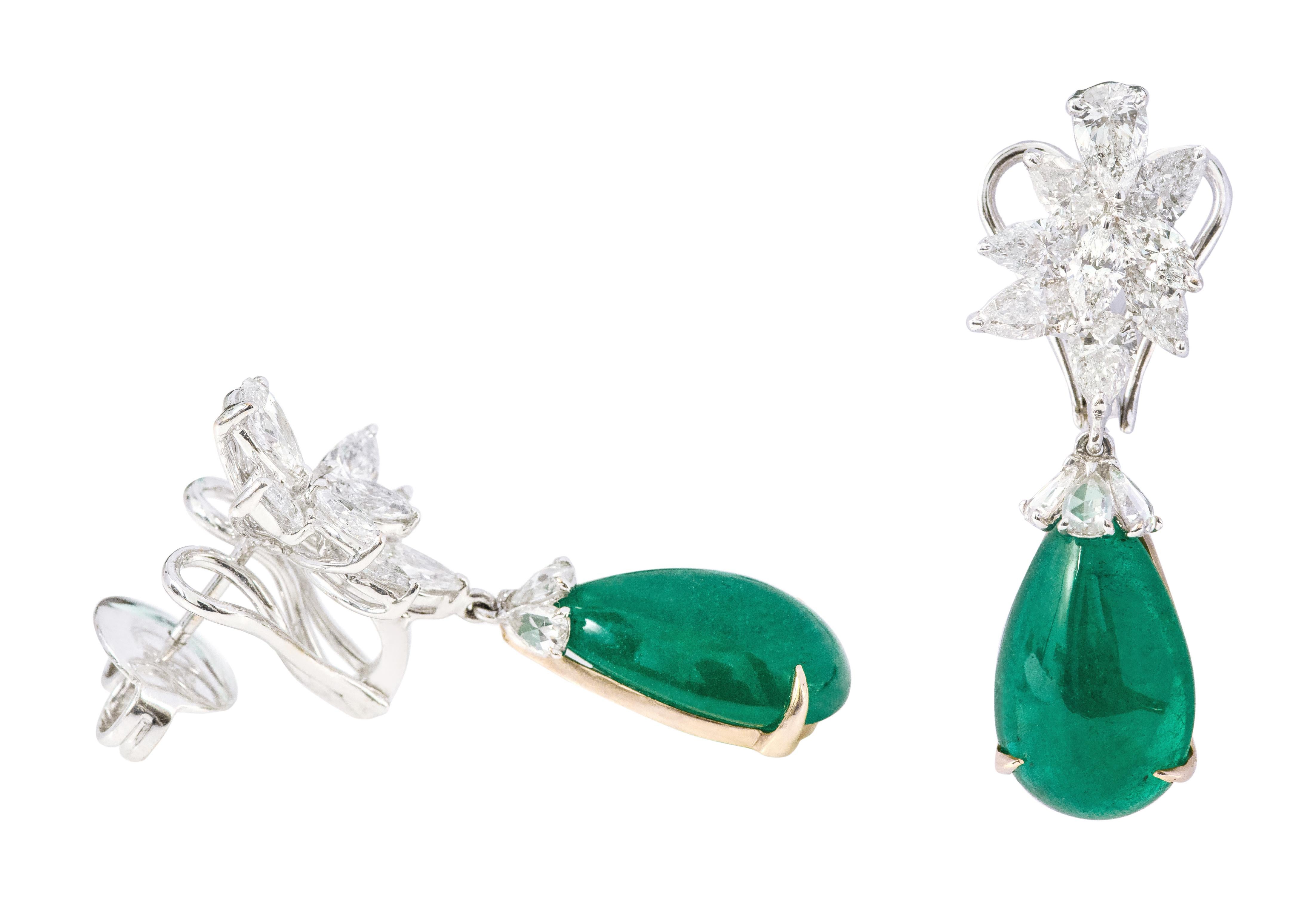 18 Karat White Gold 18.66 Carats Natural Emerald and Diamond Drop Earrings

This incredible dark green emerald and fancy shaped diamond earring is vividly magical. The solitaire pear emerald cabochon is amicably set with eagle prongs and rose cut