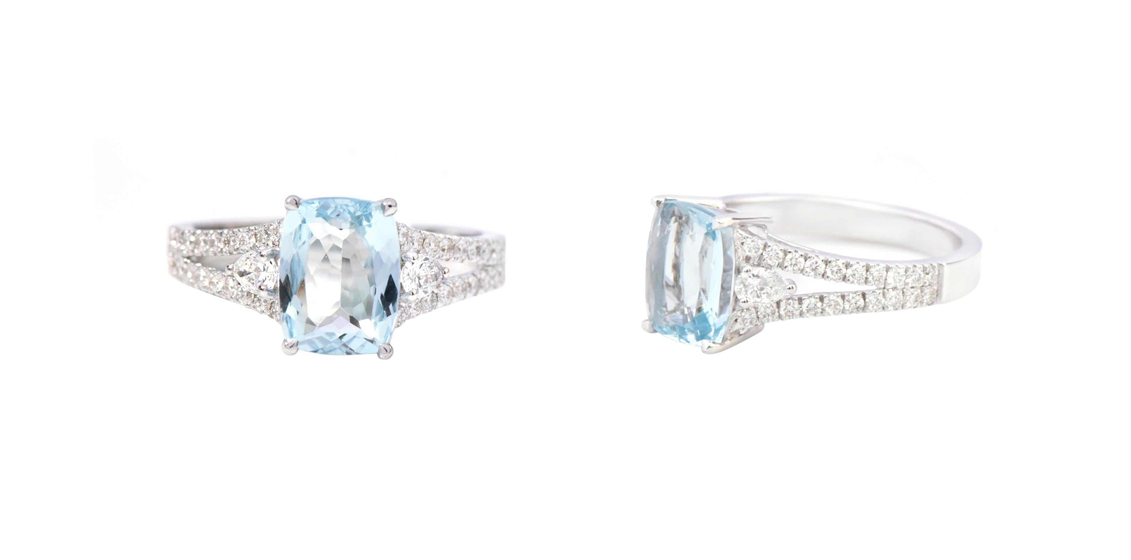18 Karat White Gold 1.87 Carat Cushion-Cut Aquamarine and Diamond Eternity Ring

This magnificent celestial aquamarine and diamond ring is captivating. The three-stone trinity ring tells a story by not only representing the said “past, present, and