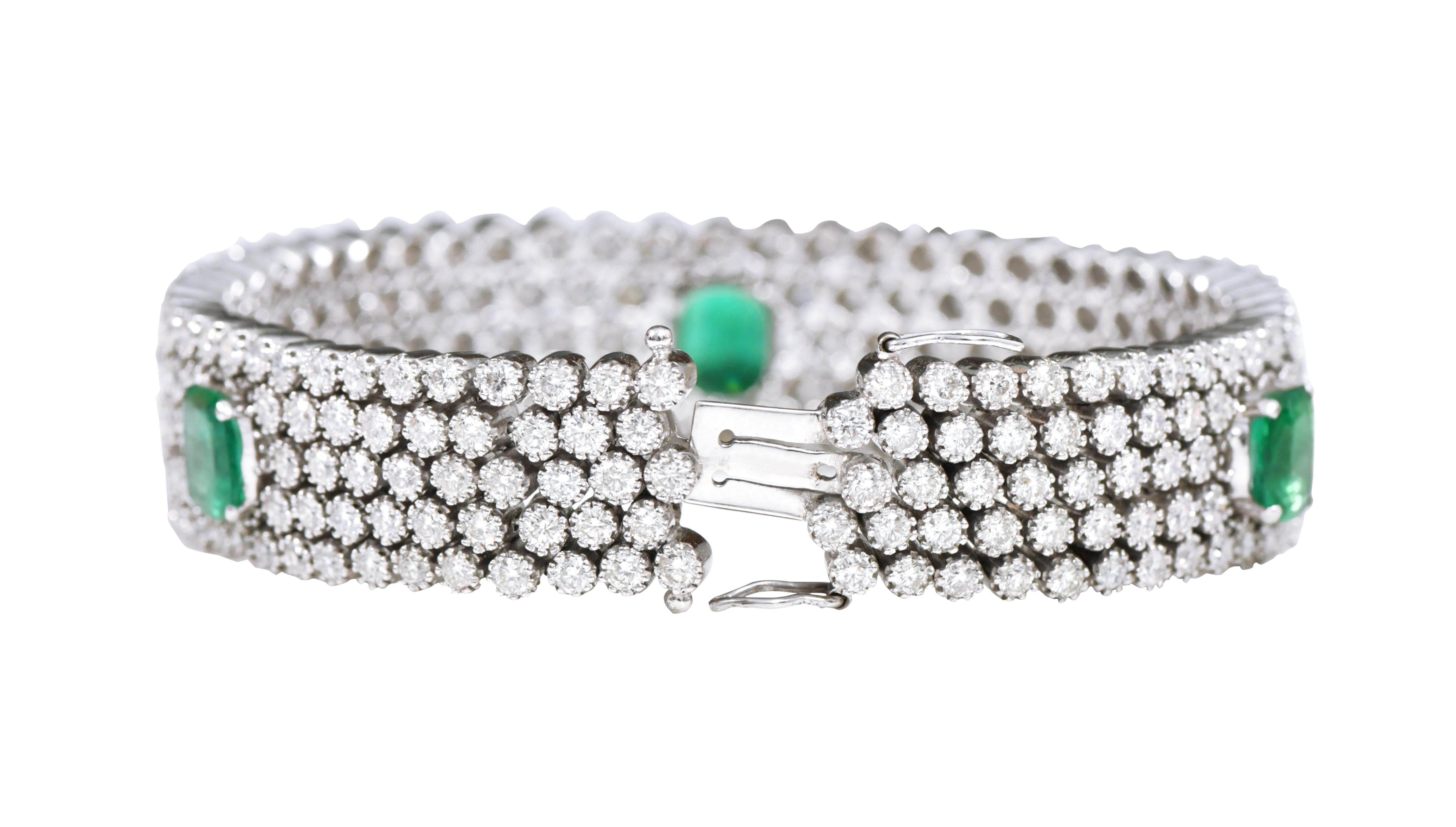 Women's 18 Karat White Gold 19.13 Carat Diamond and Emerald Contemporary Bracelet For Sale