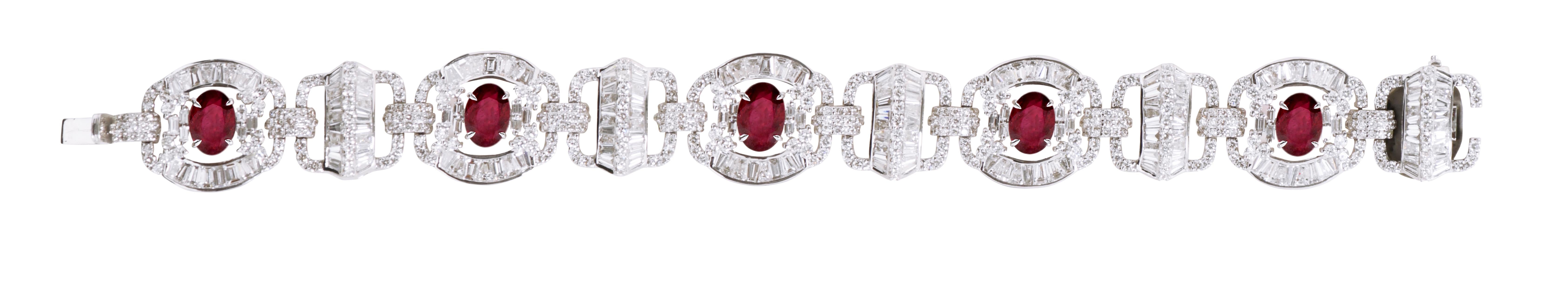 18 Karat White Gold 19.73 Carat Ruby and Diamond Cocktail Bracelet 

Timeless elegance meets an innovative design with this regal Blood Ruby and Diamond bracelet. It is formed using carefully placed Baguette-Cut Diamonds in an intricate