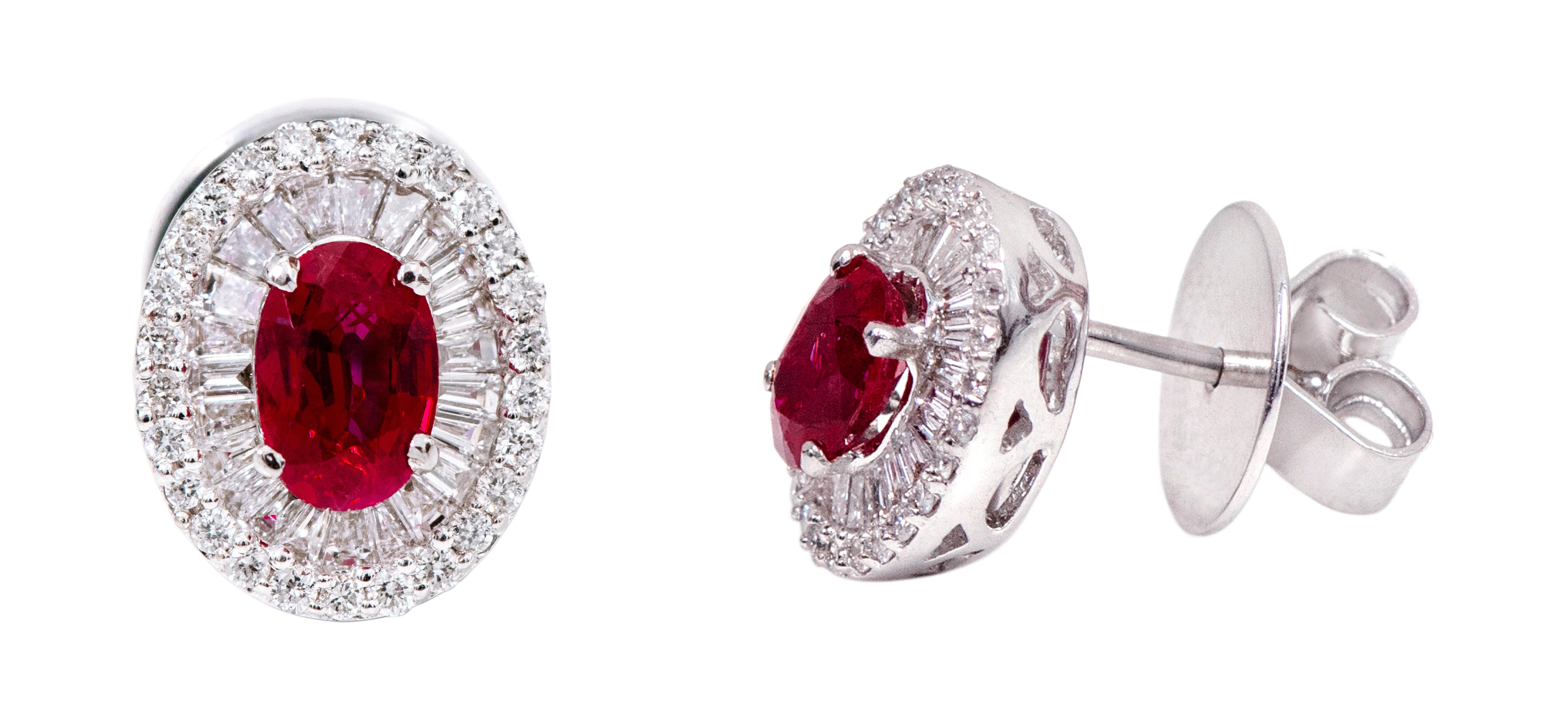 18 Karat White Gold 1.98 Carat Ruby and Diamond Cluster Stud Earrings

This exquisite crimson red ruby and double cluster diamond round and baguette earring is glorious. The solitaire oval shape ruby is brilliantly set in the classic 4-prong grain