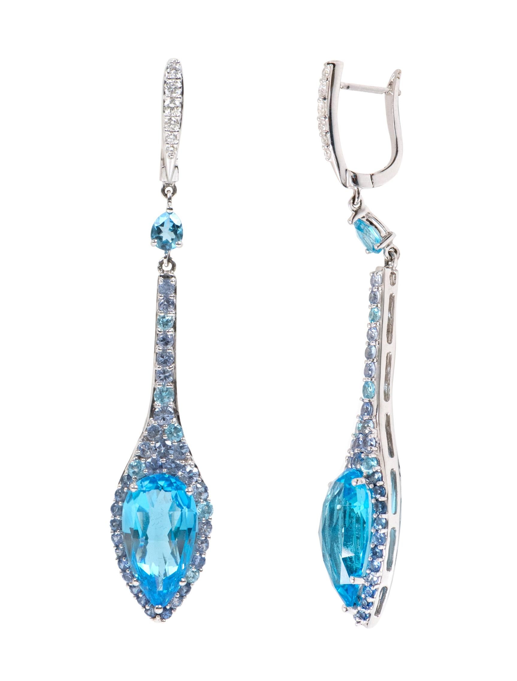 18 Karat White Gold 20.19 Carat Blue Topaz, Diamond, and Tanzanite Drop Earrings

This impeccable London blue topaz, violet blue tanzanite and diamond long drop earring is marvelous. The inverted pear drop of the solitaire blue topaz is the