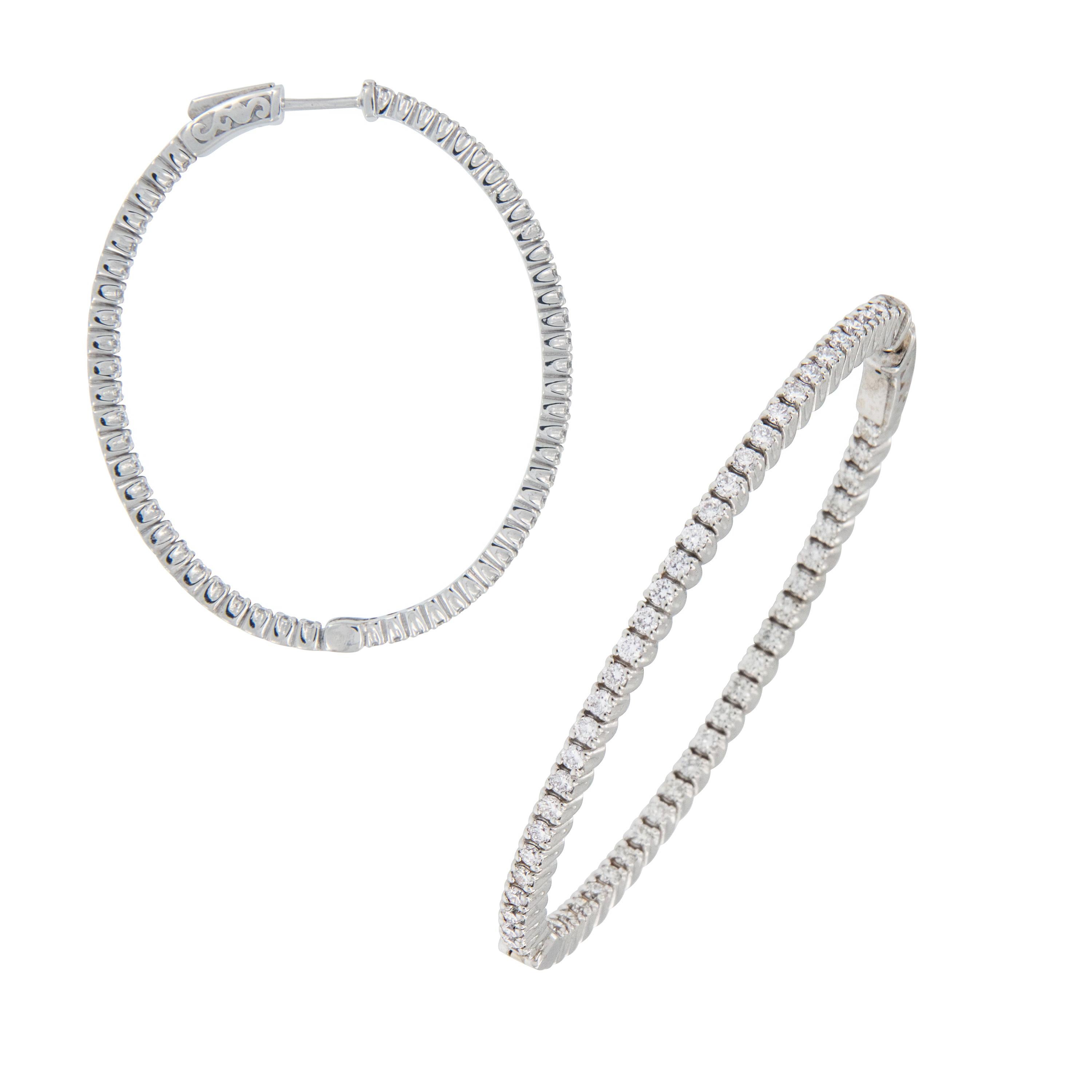 Why be like everyone else when you can stand out with these gorgeous Grande' earrings? 18 karat white gold inside / outside diamond hoops with 2.07 Cttw VS, F-G diamonds are the perfect accessory to any outfit! Earrings have posts & hinged backs for