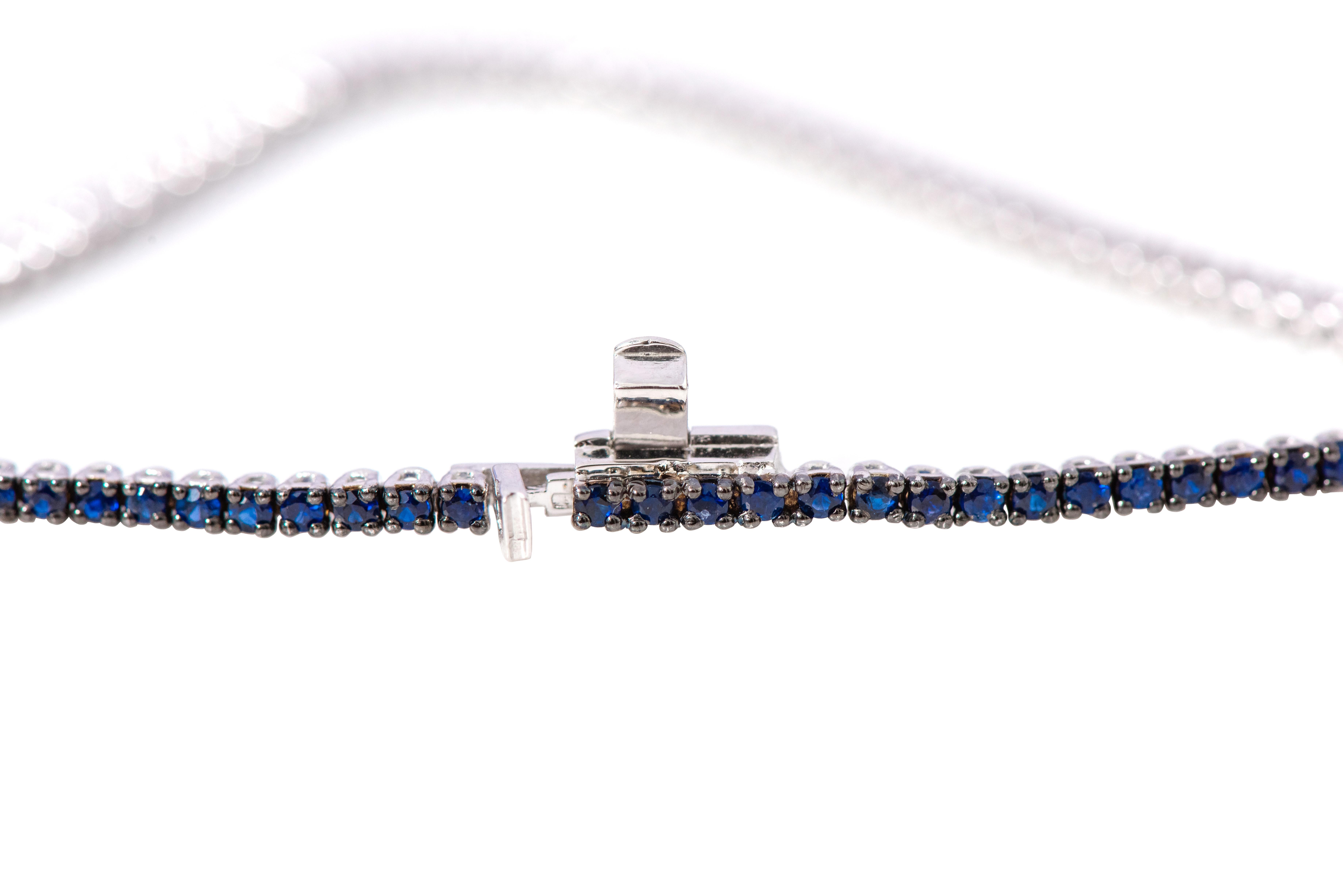 18 Karat White Gold 2.10 Carat Round-Cut Sapphire Tennis Bracelet

This classy and elegant indigo blue sapphire thin tennis bracelet is eternal. The tennis bracelet with identical size round solitaire sapphires with the perfect cut and crown is