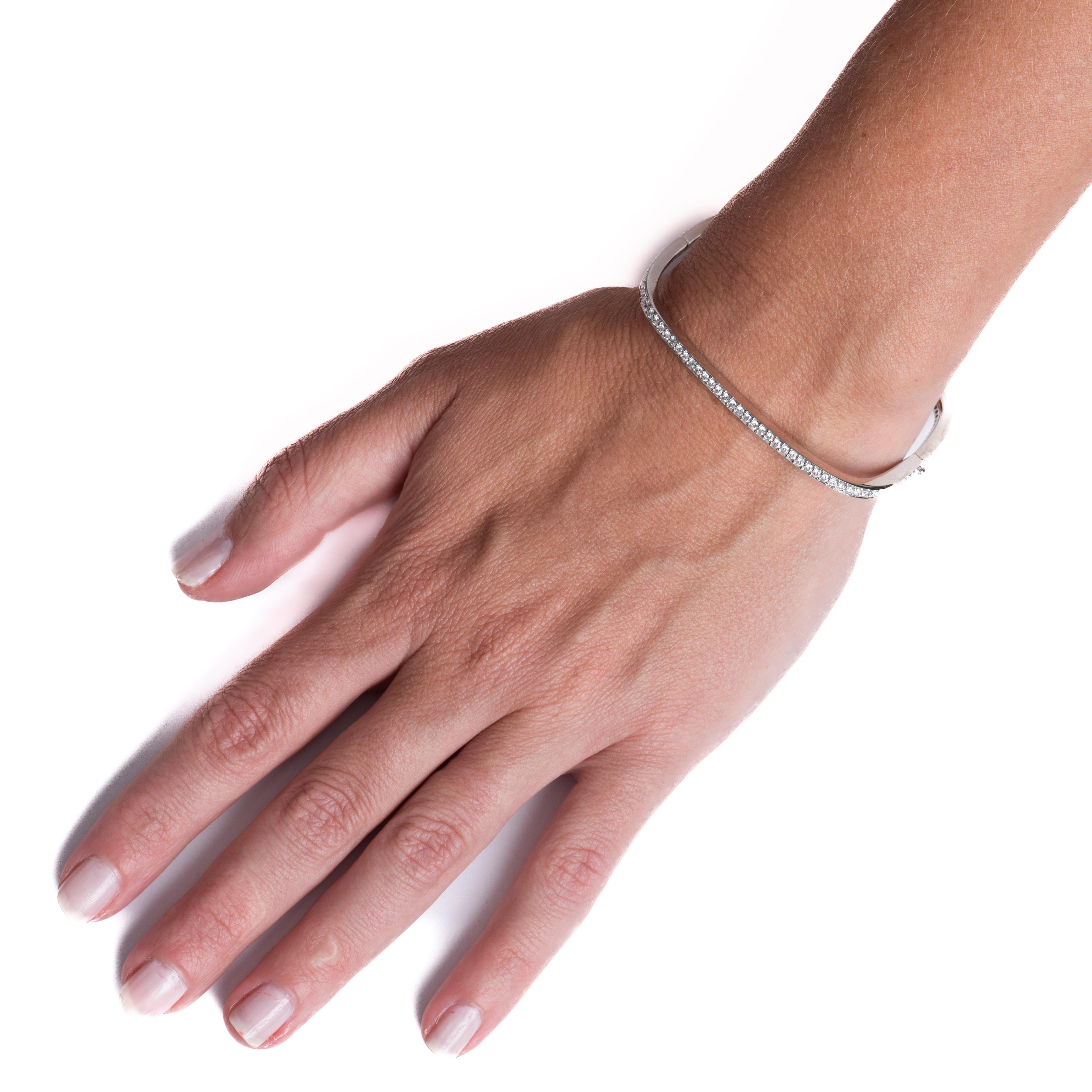 This square shaped bangle features 2.10 carat total weight in round brilliant cut natural diamonds set in 18 karat white gold. Wear alone or layer with your other favorite bracelets for a unique look. 
Measurements: Outer circumference approximately