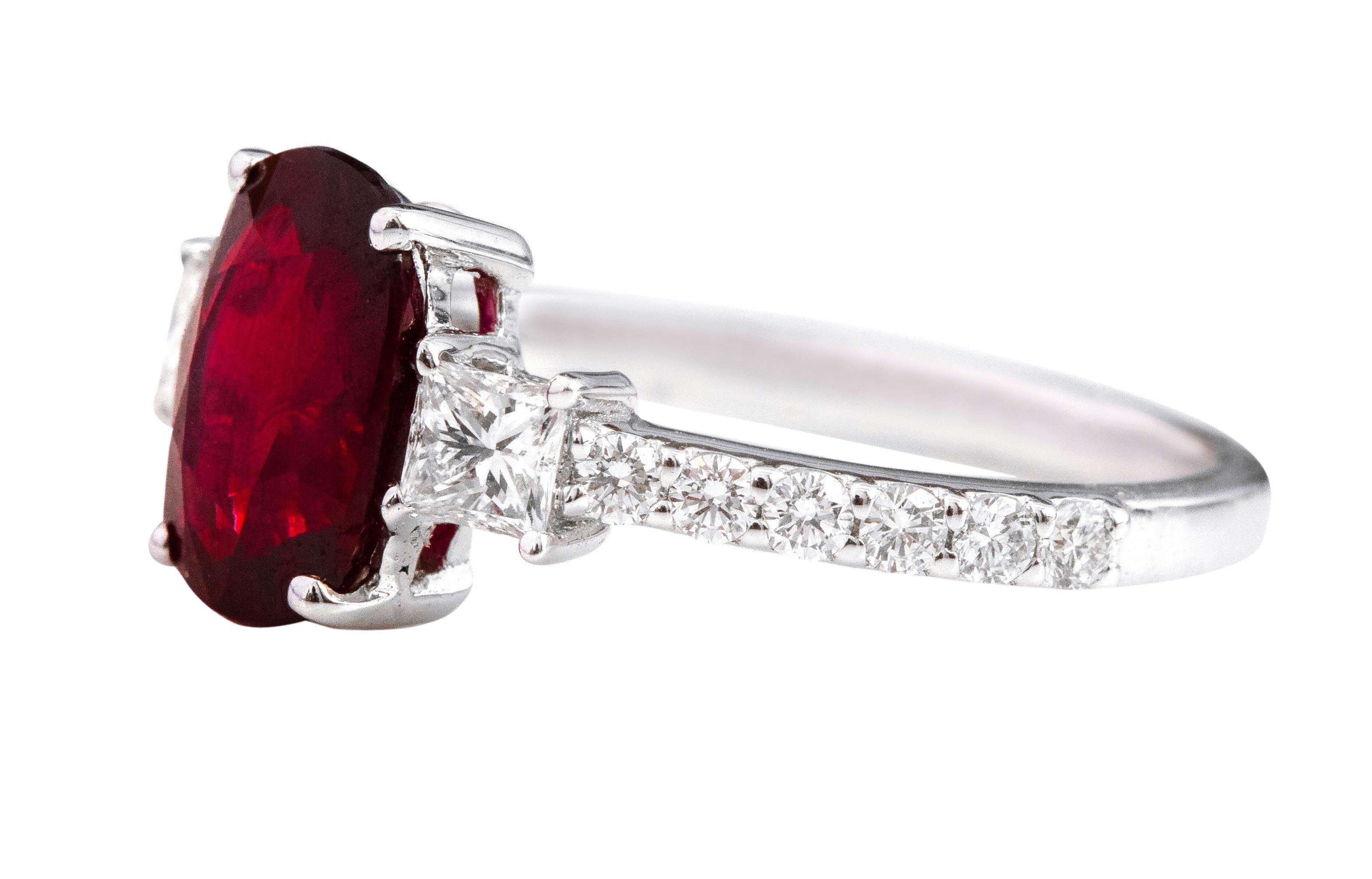 18 Karat White Gold 2.14 Carat Oval-Cut Ruby and Diamond Three-Stone Ring

This exceptional crimson red ruby and diamond trinity ring is impressive. The three-stone trinity ring tells a story by not only representing the said “past, present, and