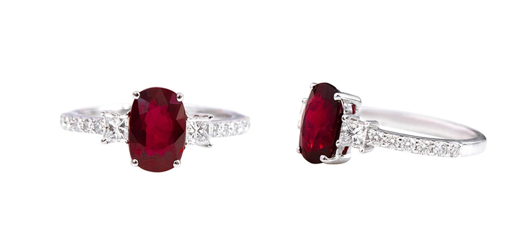 Oval Cut 18 Karat White Gold 2.14 Carat Oval-Cut Ruby and Diamond Three-Stone Ring For Sale