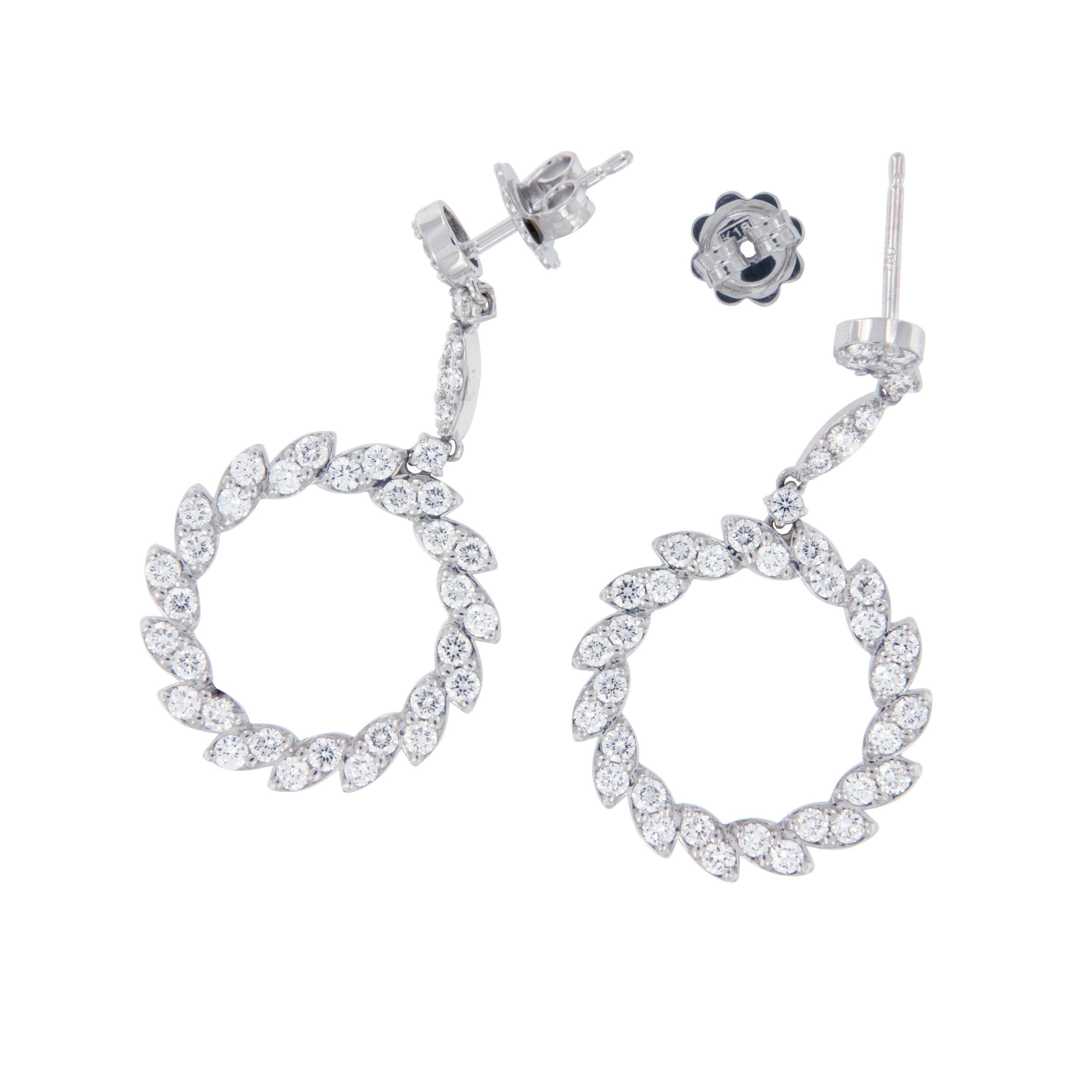 Created in refreshing 18 karat white gold, these drop earrings with 2.15 Cttw VS clarity, F-G colored round brilliant cut diamonds are set in marquise shapes for a stunning effect. The circle commonly represent unity, wholeness, and infinity. Wear