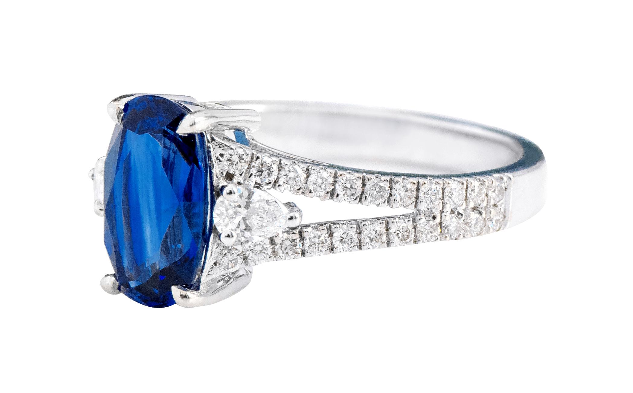 18 Karat White Gold 2.24 Carat Oval-Cut Sapphire and Diamond Three-Stone Ring

This magnificent admiral blue sapphire and diamond ring is captivating. The three-stone trinity ring tells a story by not only representing the said “past, present, and