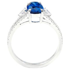 18 Karat White Gold 2.24 Carat Oval-Cut Sapphire and Diamond Three-Stone Ring