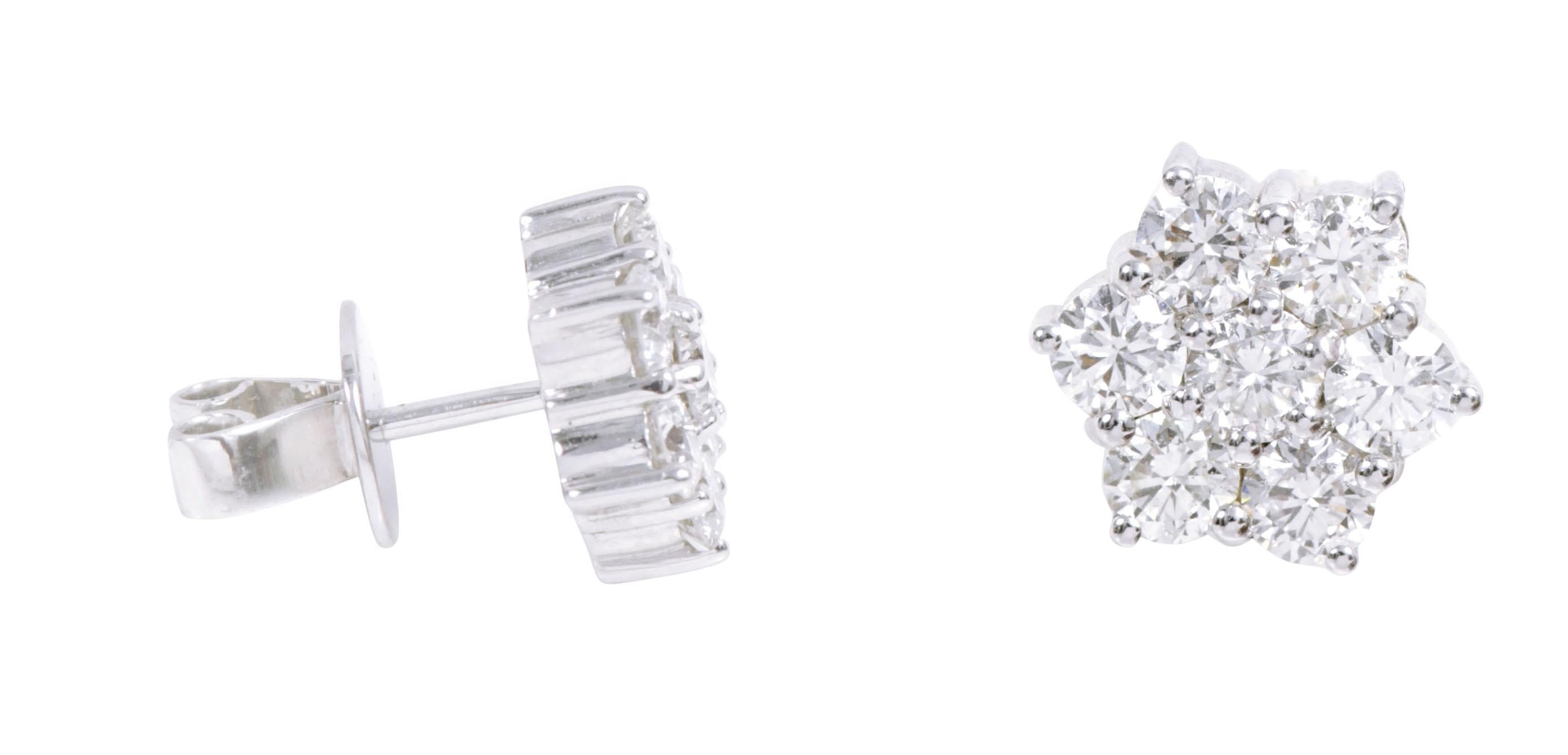 18 Karat White Gold 2.25 Carat Diamond Stud Earrings 

This timeless invisible setting round diamond stud earring is sensational. It’s a sophisticated and very intricate design setting wherein 7 identical round diamonds are carefully combined to