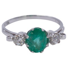 18 Karat White Gold, 2.30 ct Emerald and 0.34ct Diamond Three-Stone Ring, 1950s