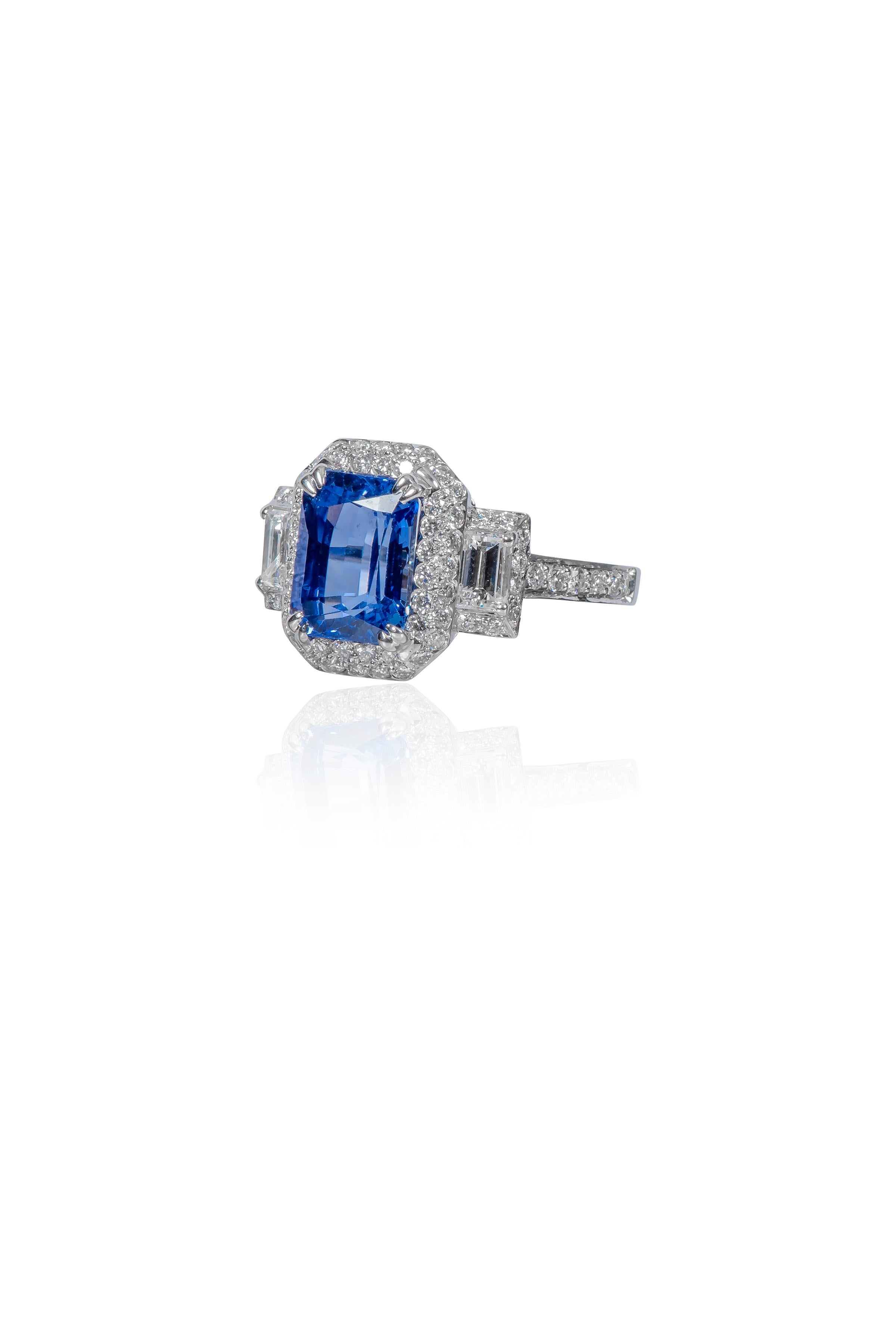 18 Karat White Gold 2.36 Carat Sapphire and Diamond Three-Stone Cluster Ring 

The elegantly designed 3-stone classic ring is defined by several distinct elements giving it a new form altogether. The radiant cornflower blue sapphire set in double