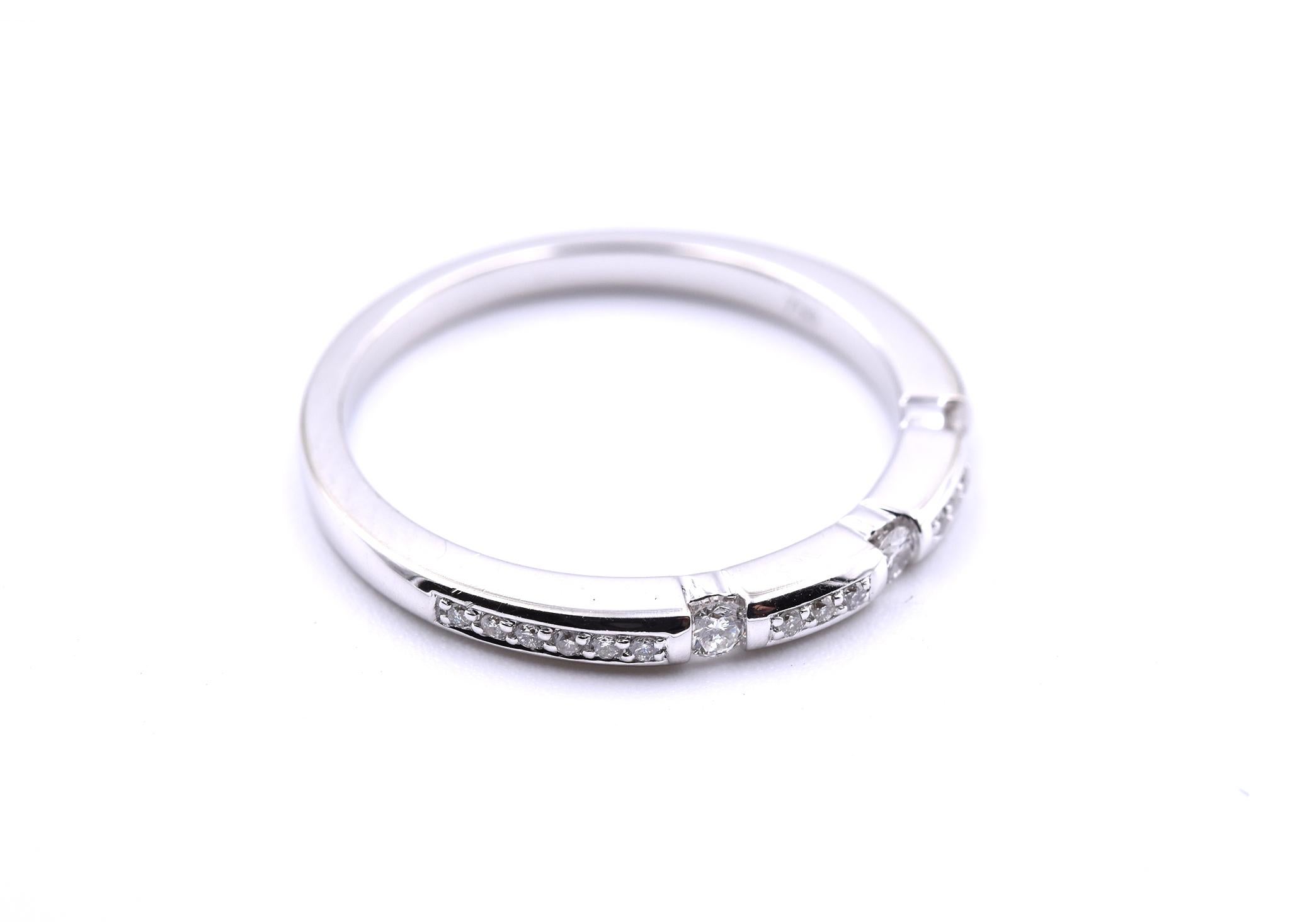 Designer: custom design
Material: 18k white gold
Diamonds: 21 round brilliant cut diamonds = 0.25
Color: H
Clarity: SI1
Dimensions: band is 2mm wide
Ring size: 7 (please allow two additional shipping days for sizing requests)
Weight: 3.1 grams
