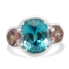 Anello a 3 pietre con zircone blu e rosa in oro bianco 18 carati