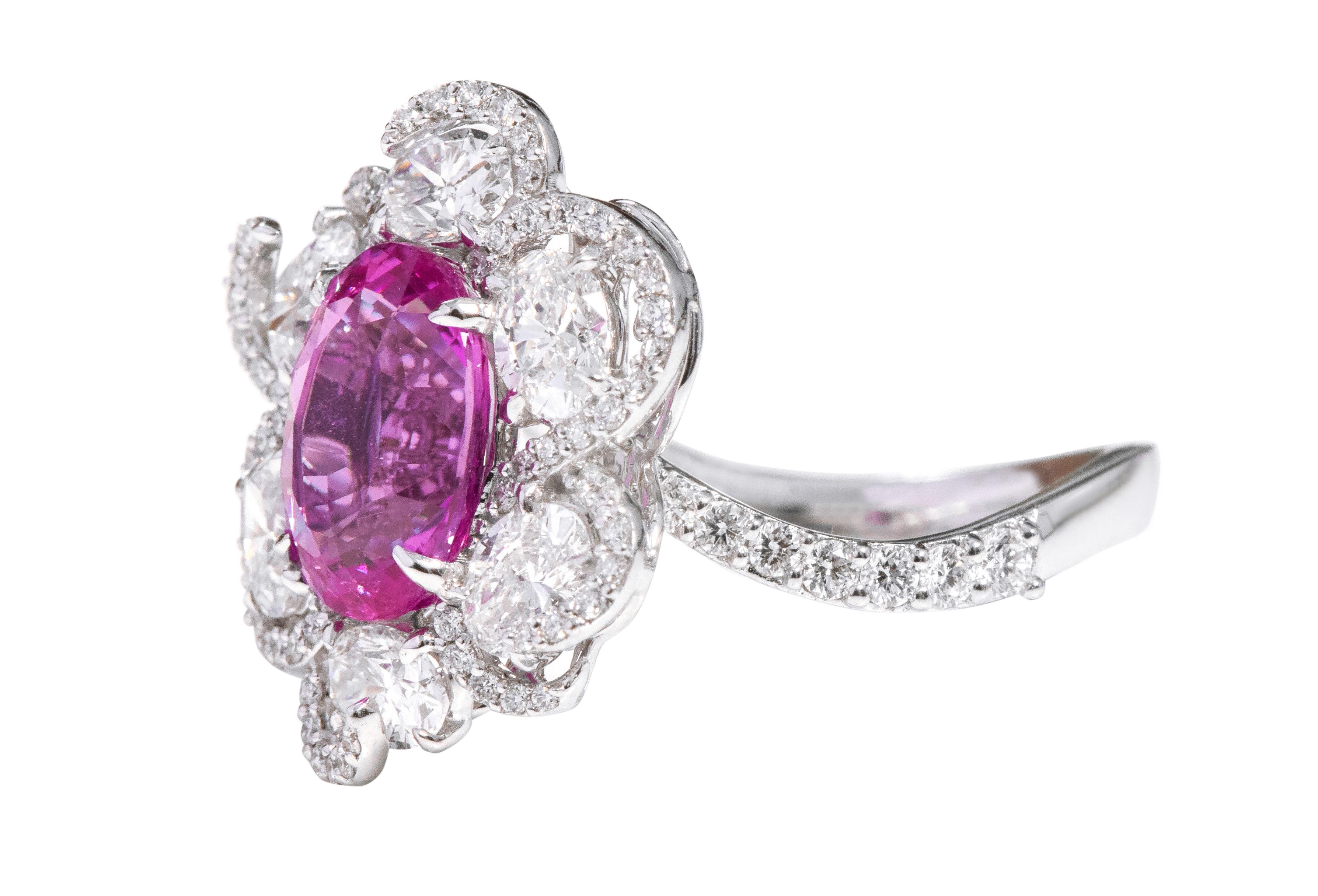 18 Karat White Gold 3.14 Carat Oval-Cut Solitaire Pink-Sapphire and Diamond Cocktail Ring

This incredible fuschia pink sapphire and diamond ring is magical. The leveled-up solitaire oval pink sapphire in the center in the eagle prong setting is