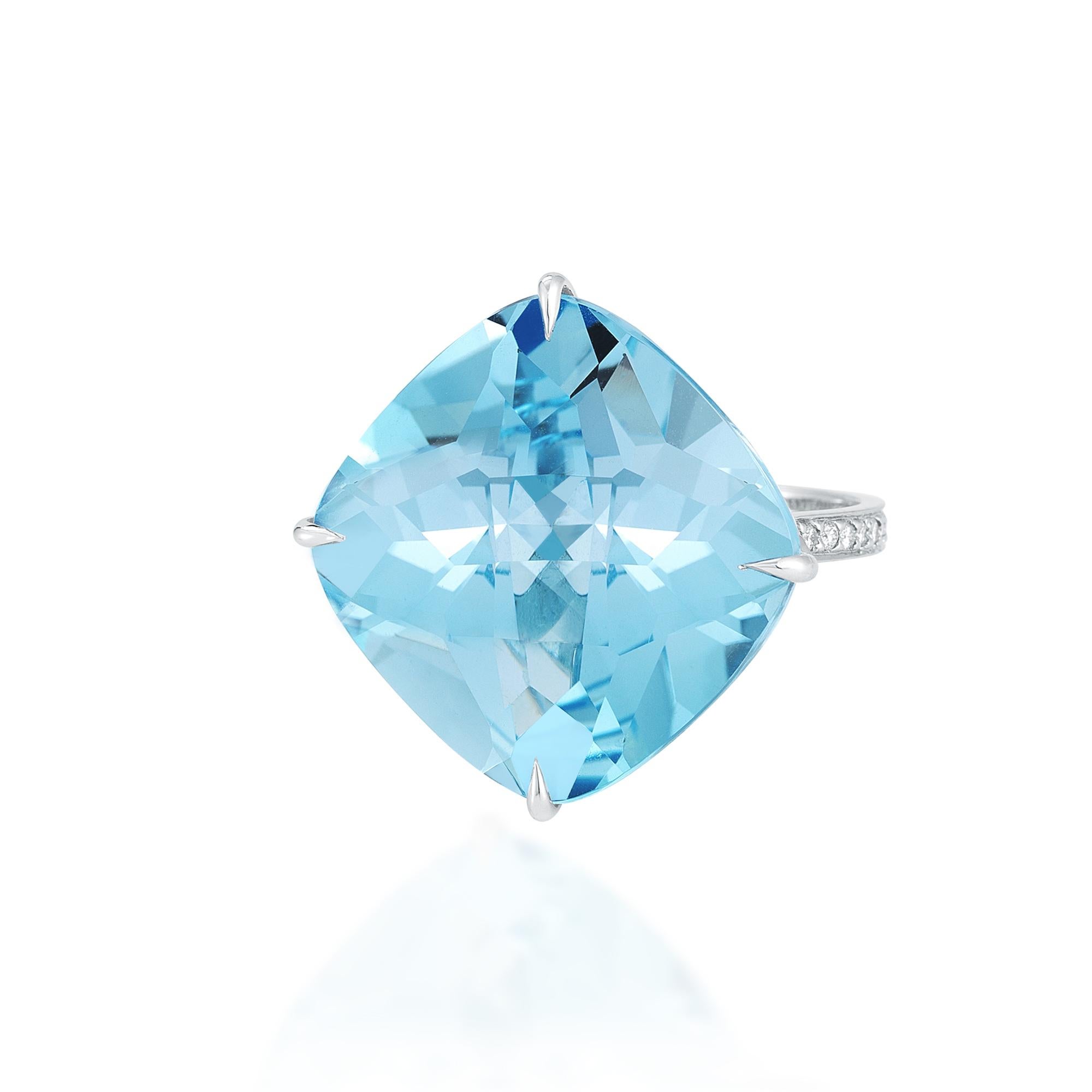 'By the Pool' ring features a square blue topaz with pave-set round, brilliant diamonds set in 18 karat white gold. 

Blue Topaz (20mm): 33.5 carats
Diamonds: 0.15 carats (D-G color, VS clarity) 

SU BT 20 
