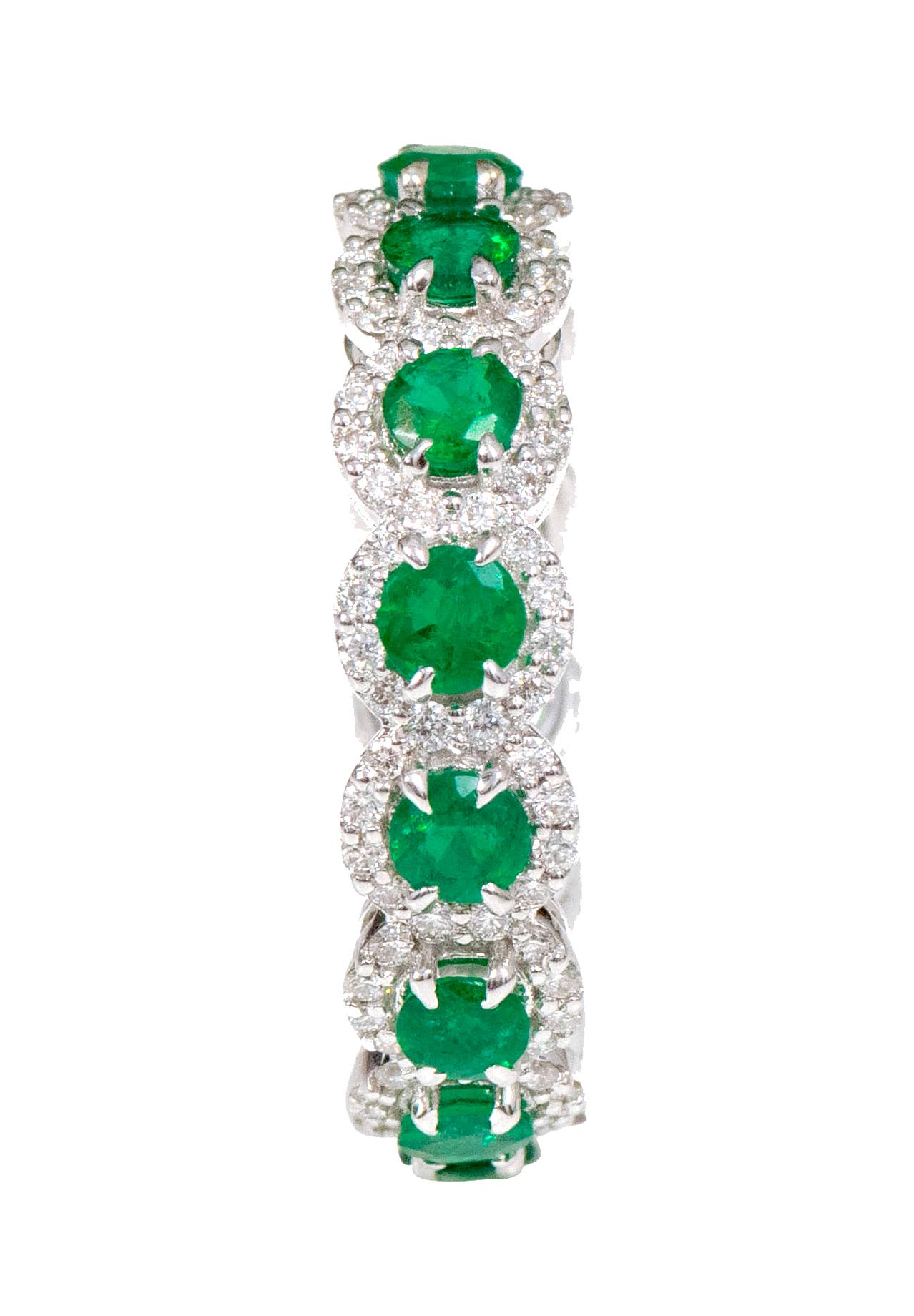 18 Karat White Gold 3.39 Carat Emerald and Diamond Cluster Eternity Band Ring

This incredible parakeet green emerald and diamond cluster band is remarkably brilliant. The solitaire round cut emeralds in eagle prong setting are magnificently