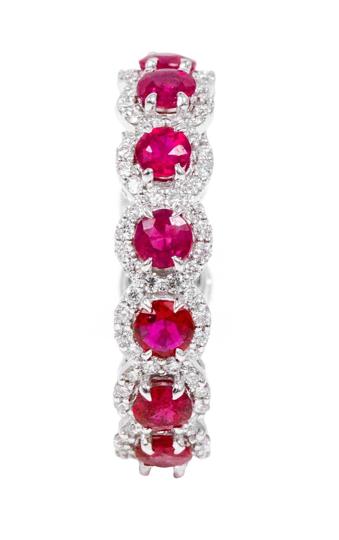 18 Karat White Gold 3.39 Carat Ruby and Diamond Cluster Eternity Band Ring

This sensational scarlet red ruby and diamond cluster band is timeless. The solitaire round cut rubies in eagle prong setting are elegantly surrounded with a merged layer of