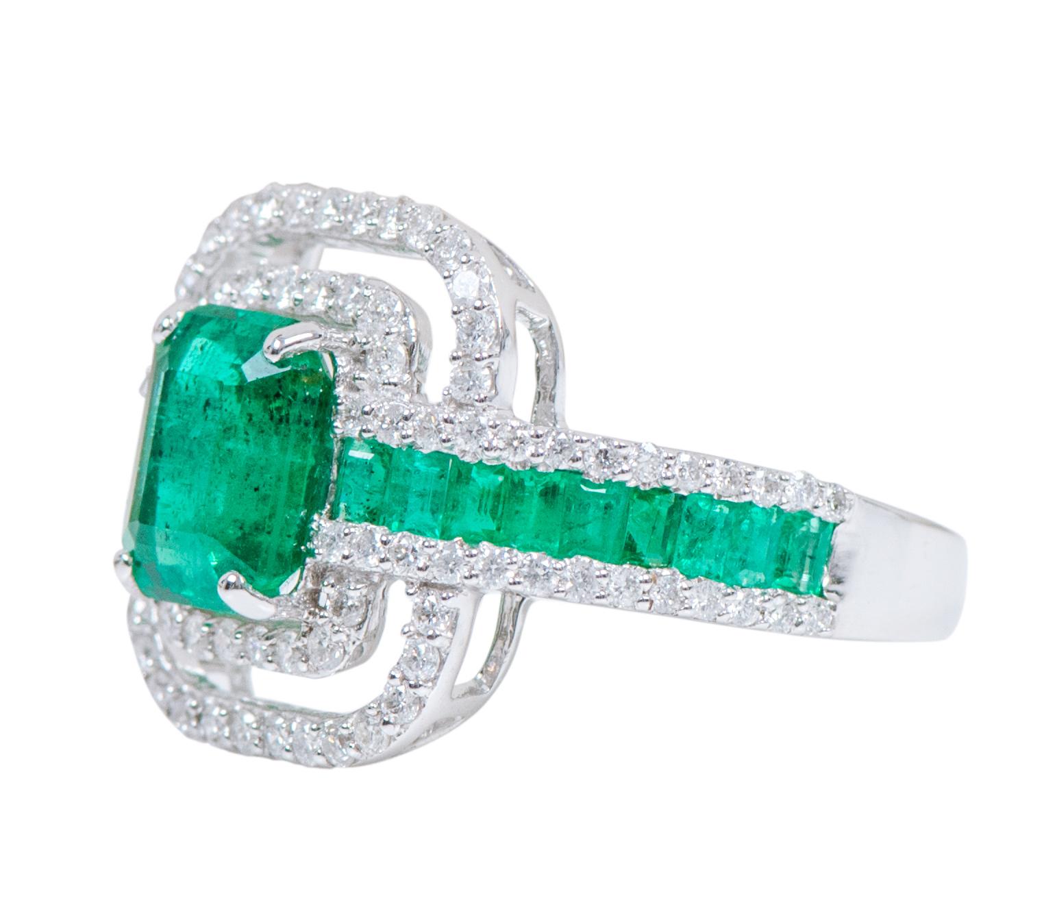 18 Karat White Gold 3.41 Carat Natural Emerald and Diamond Solitaire Cluster Band Ring

This magnificent vibrant green emerald and diamond double cluster art-deco contemporary ring is fabulous. The solitaire emerald cut emerald in eagle claw setting