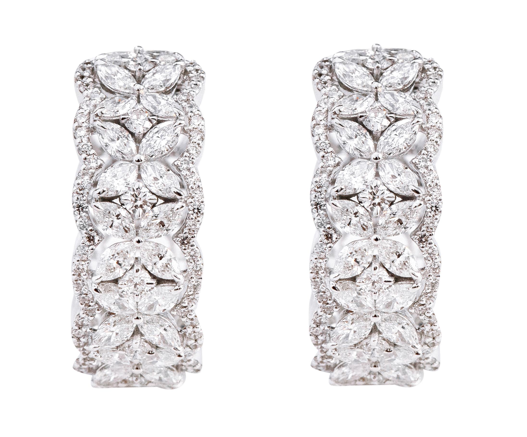 18 Karat White Gold 3.53 Carat Diamond Mini-Hoop Earrings

This glamorous criss-cross half-hoop earring with the combination of marquise cut and round diamonds is elegant. The angled identical solitaire marquise diamonds form the flower with the