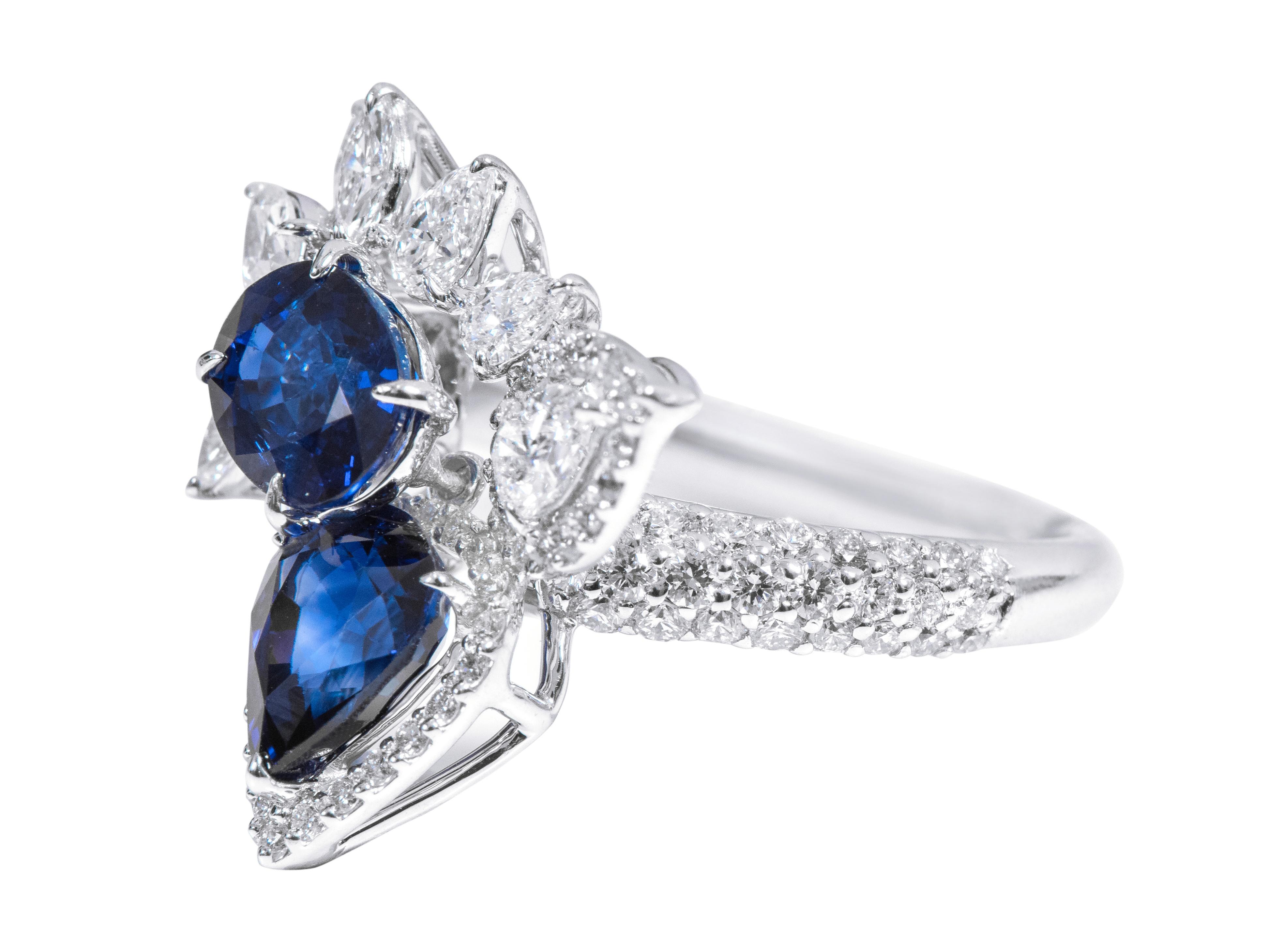 18 Karat White Gold 3.54 Carat Sapphire and Diamond Cocktail Ring

This marvelous royal blue sapphire and diamond cocktail ring is beyond exemplary. The inverted pear shape solitaire sapphire with a leveled down gaped open pave set diamond cluster