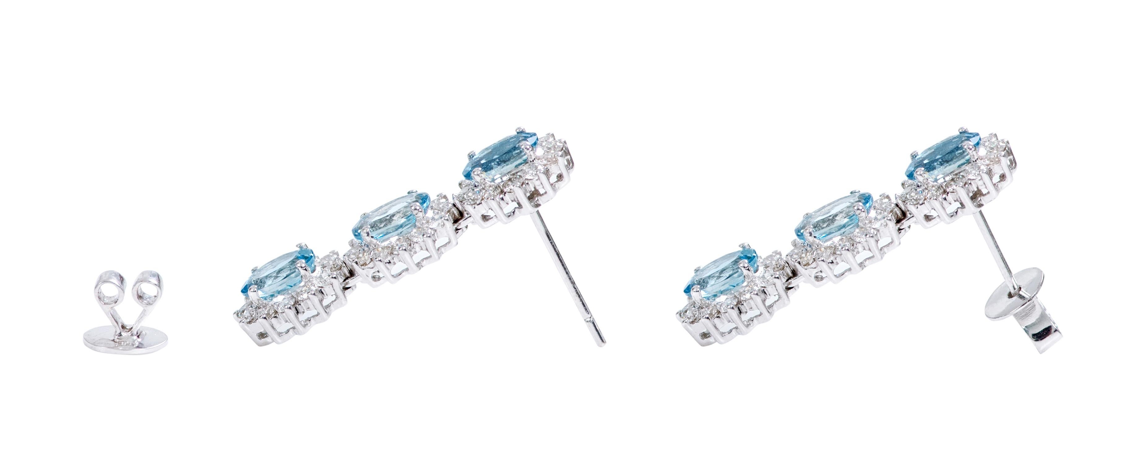 Oval Cut 18 Karat White Gold 3.78 Carat Aquamarine and Diamond Cluster Dangle Earrings For Sale