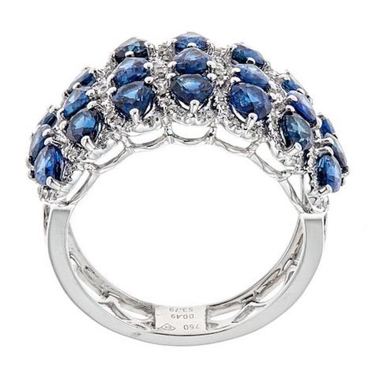 18 Karat White Gold 3.79 Carat Sapphire and 0.50 Carat Diamond Cluster Ring

Crafted in sleek 18k White gold, this ring represents glamour and style. Glistening pear-shaped sapphires layered in three rows on top of the ring, creating a dramatic