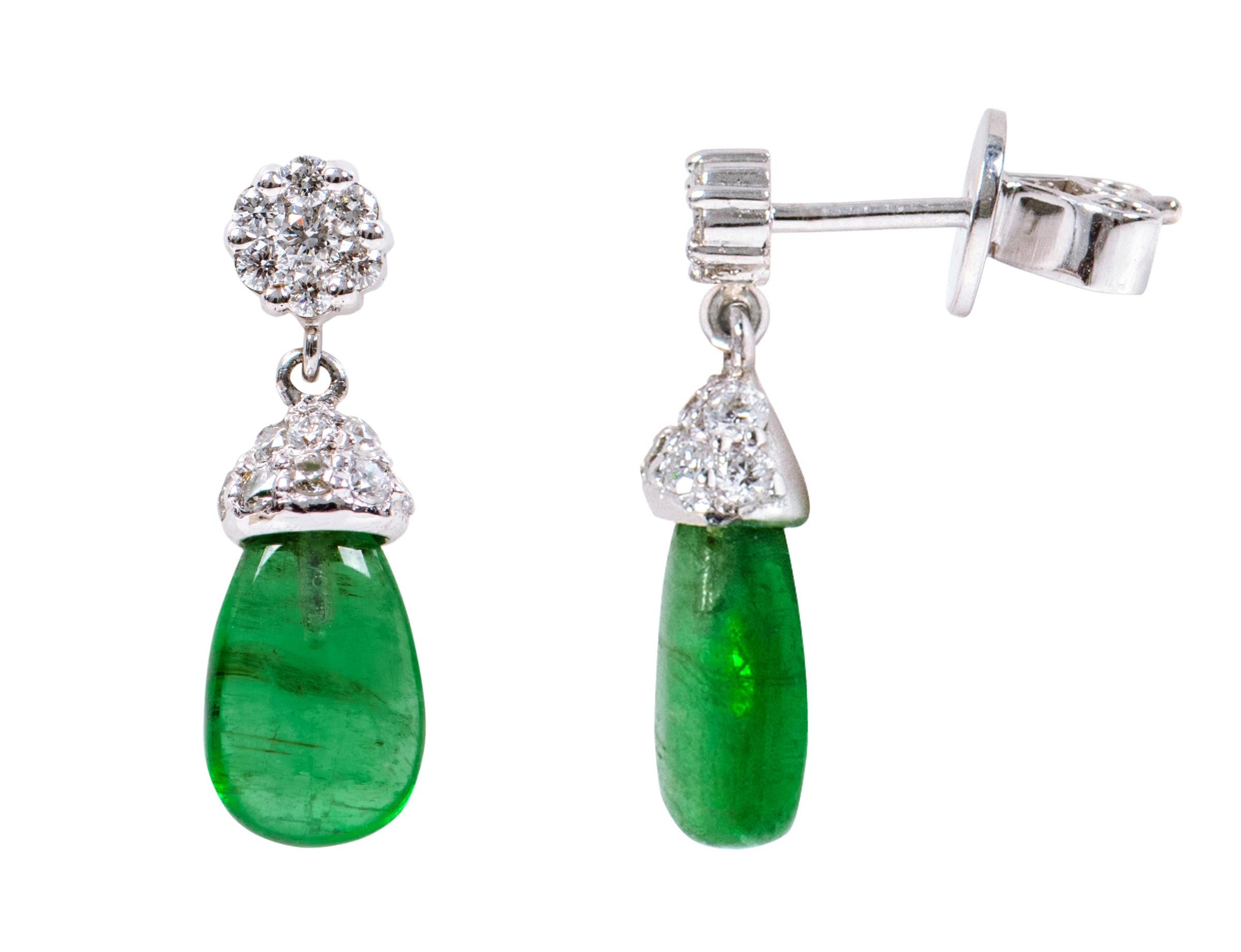 18 Karat White Gold 3.80 Carat Natural Emerald and Diamond Drop Earrings

This magnificent shamrock green emerald and diamond drop earring is fabulous. The closely pave set diamond cap covering the half-drilled transparent emerald teardrop from the