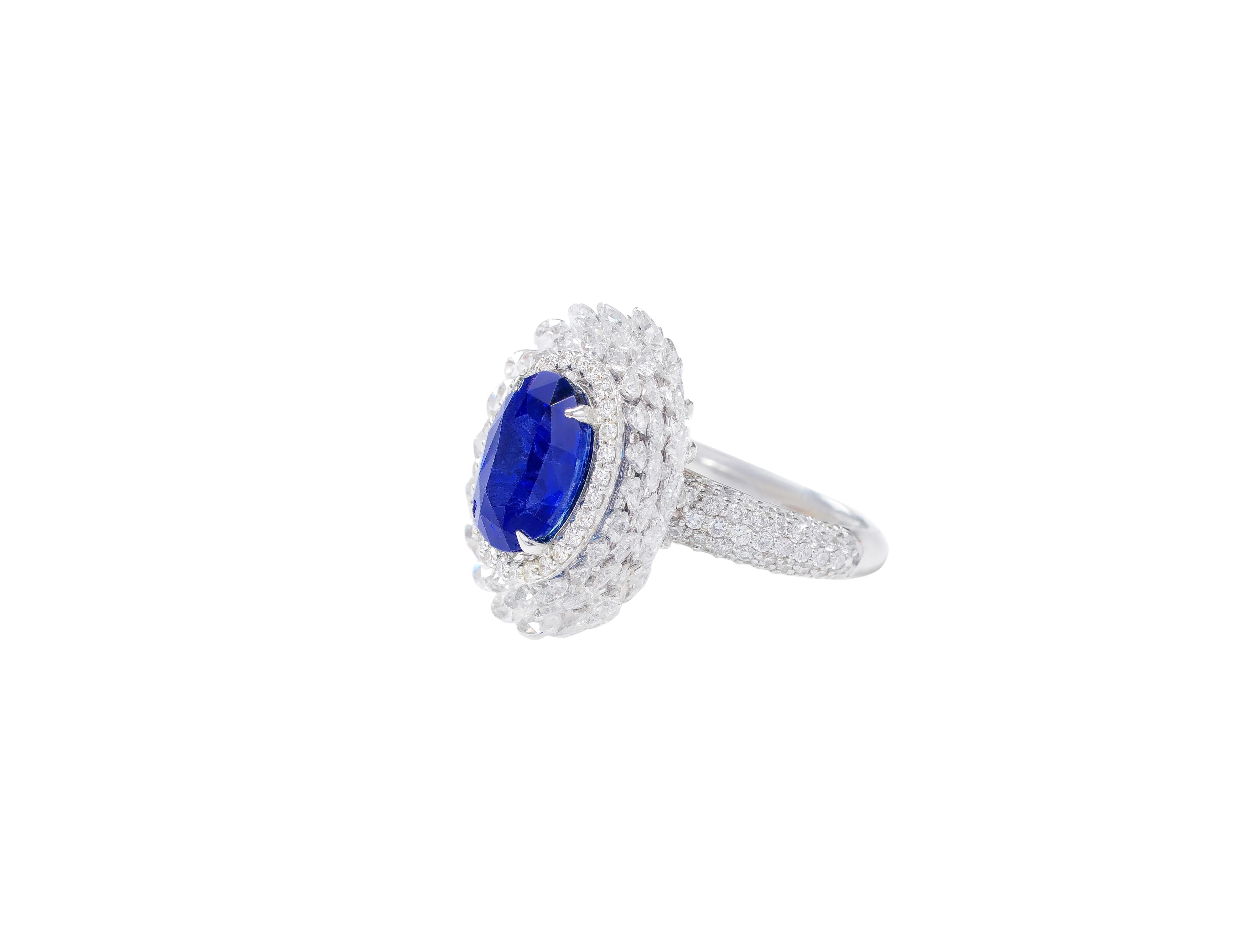 18 Karat White Gold 3.80 Carat Sapphire and Diamond Cocktail Ring

This impeccable cocktail royal blue sapphire and diamond rose-cut ring is a prolific design. The ring sets itself apart with the exquisite oval blue sapphire surrounded first by a
