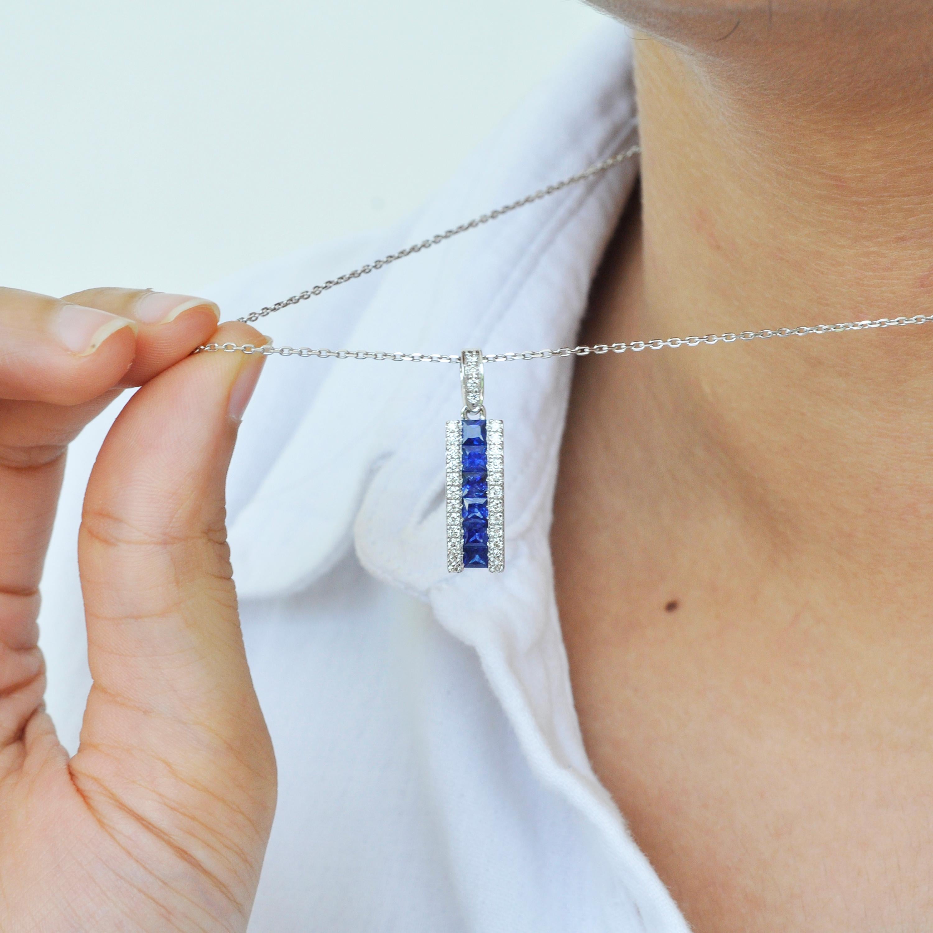 Contemporary 18 Karat White Gold 3MM Channel Set Princess Cut Blue Sapphire Diamond Pendant For Sale