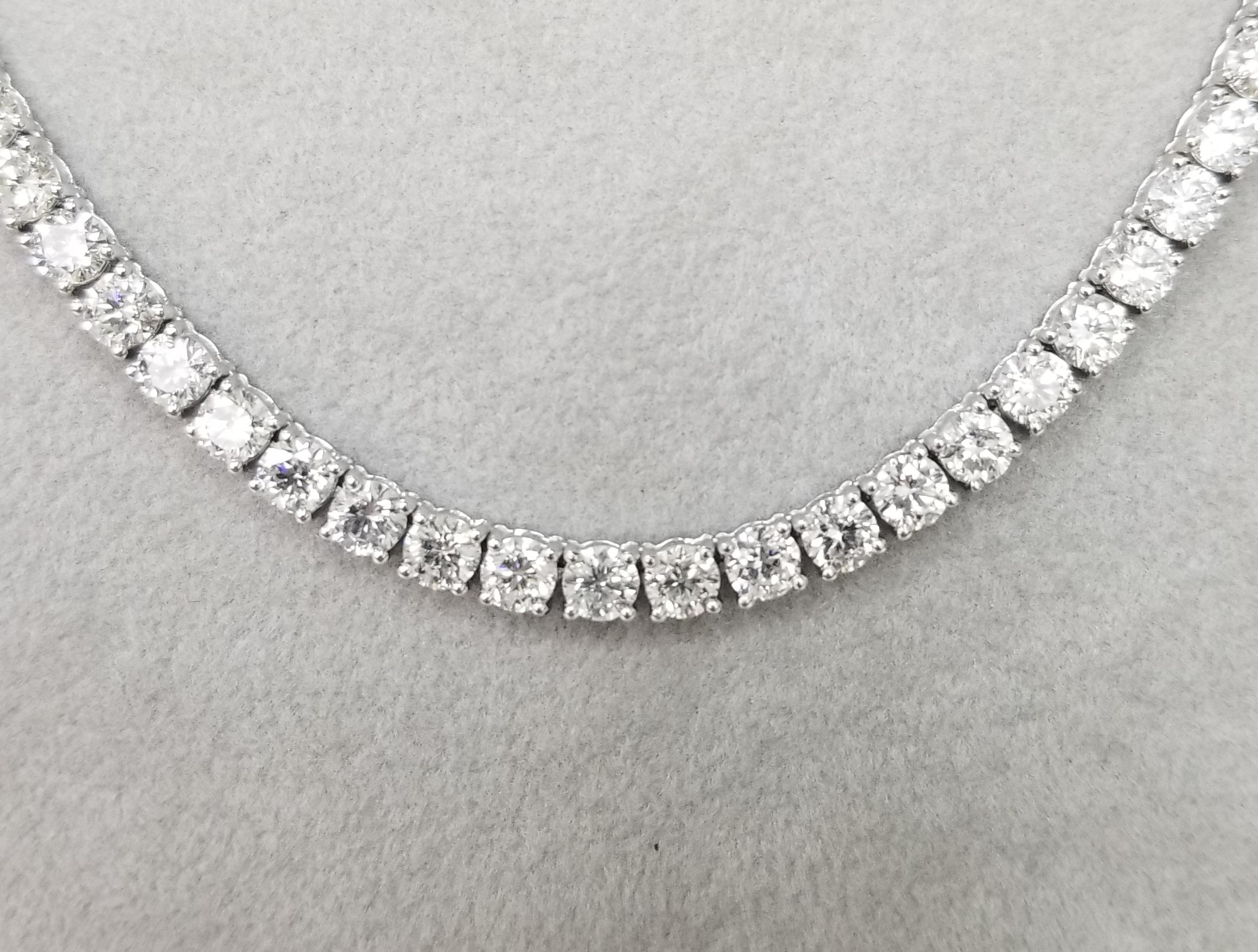 About
18k white gold 4 prong diamond necklace, containing 
 Specifications:
    main stone: ROUND CUT DIAMONDS
    diamonds: 110 PIECES
    carat total weight: 20.51cts.
    center diamond:  3.6mm
    color: F-G
    clarity: VS2-SI2
    brand: